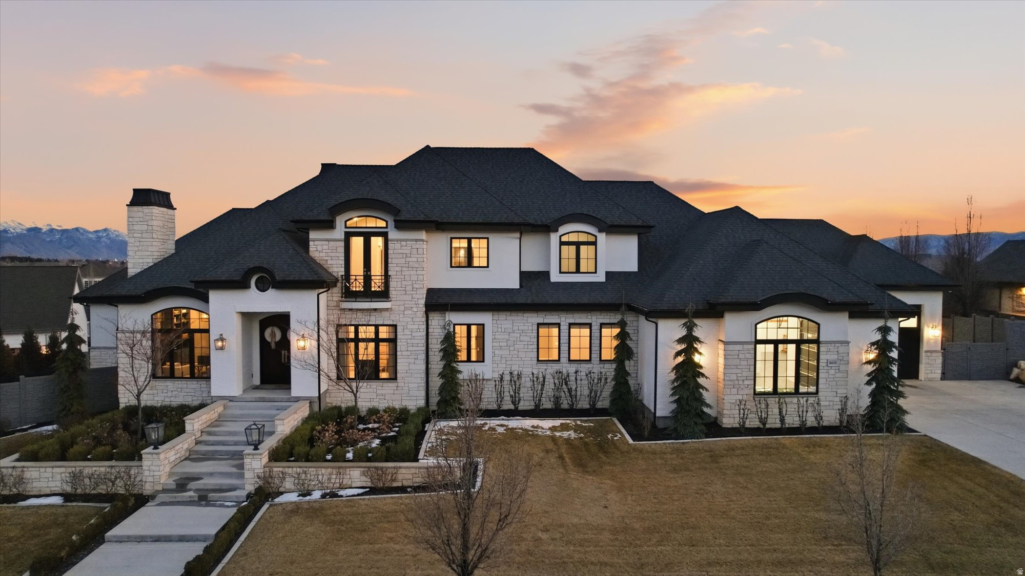 **OPEN HOUSE Saturday, April 18th | 1:003:00 PM**   An extraordinary opportunity to own one of Highland's most impressive luxury estates, ideally located in the prestigious Country French Estates-widely recognized as one of Utah's most sought-after luxury communities.  This exceptional custom residence by Highland Custom Homes offers over 10,000 square feet, 7 bedrooms, and 6.5 bathrooms, thoughtfully designed to blend timeless architecture, refined craftsmanship, and elevated modern living.  Inside, soaring ceilings, expansive windows, and beautifully curated finishes create a warm yet sophisticated atmosphere. Ten-foot ceilings on the main level and basement, along with nine-foot ceilings upstairs, enhance the home's open, grand feel.  The gourmet kitchen is designed to impress-featuring a stunning marble island, quartz perimeter countertops, custom cabinetry, premium Thermador appliances, and a highly functional Costco door for effortless everyday living.  The home offers two luxurious main-level primary suites, spacious secondary bedrooms with walk-in closets, and laundry rooms on every level. The primary suite is a true retreat, complete with heated marble floors, dual shower heads, and spa-inspired finishes.  The fully finished basement with 10-foot ceilings is ideal for entertaining, highlighted by dramatic folding glass doors that open seamlessly to the backyard. The space also offers flexibility for a mother-in-law suite, nanny quarters, or future ADU.  Modern comfort and efficiency are elevated with three HVAC systems creating 12 climate zones, whole-home humidifiers and water softeners, integrated audio, remote-controlled fireplaces, and motorized blinds and drapes.  Step outside to your private resort-style backyard featuring a heated pool and spa, a covered deck with gas hookups for outdoor dining, permanent EverLights exterior lighting, and additional power for custom lighting and entertaining.  The heated and insulated garage includes extra-wide and deep bays along with 30-foot RV parking. Additional highlights include heated floors in the mudroom and primary bath, a dedicated dog wash room, and elegant marble and stone finishes throughout.  Many furnishings and appliances are included, offering a rare turnkey luxury opportunity.  Join us at the Open House or schedule your private showing today-homes of this caliber and location rarely become available.  Square footage provided from recent appraisal; buyer to verify all info.