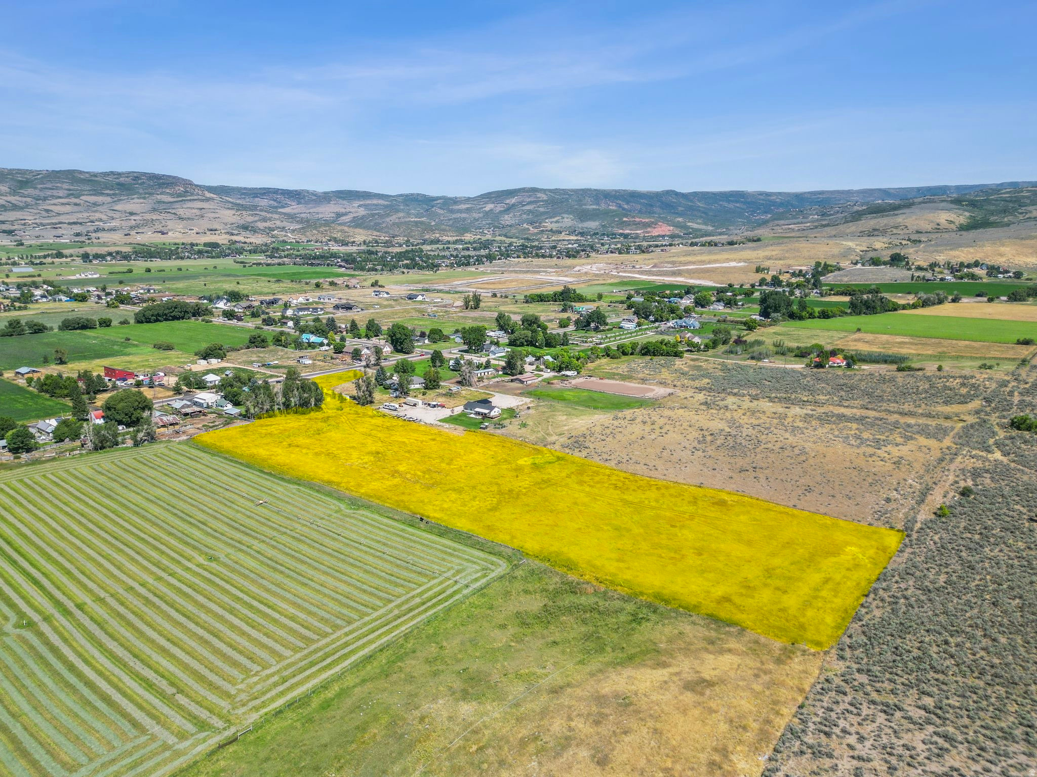 Remarkable 8.35 acres in the highly sought after Center Creek area. Truly one of the prettiest places to call home in the valley. Mountain and valley views surround this beautiful land. Well is dug, it just needs a pump. Utilities are available at the street. 4 water shares included.  Access the property from 2400 S, drive along the East fence line for 3442 E 2400 S, cross the creek and enjoy the peace and beauty that surrounds the area.  Partake in country living while accessing the conveniences and amenities nearby. Only 5 minutes from Heber Main Street, 20 minutes to Park City, 25 minutes to Orem, and 50 minutes to Salt Lake. Endless outdoor activities and trail access right from the property. Animal rights included and no HOA. Information provided as a courtesy, buyer to verify.