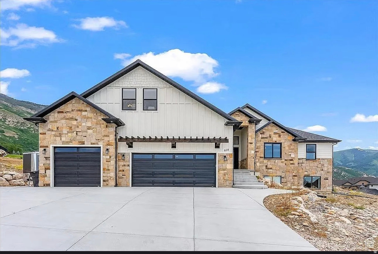Welcome to this stunning custom rambler located in the highly sought-after North Ogden Cove, known for its incredible mountain, valley, and lake views. Situated on a spacious .56-acre lot, this home offers exceptional space, privacy, an RV pad, and plenty of room to enjoy the beautiful surroundings. The open-concept main level features a spacious great room with a fireplace, abundant natural light, and a gorgeous kitchen complete with custom cabinetry, an oversized island, gas range, double ovens, and a large walk-in pantry. The primary suite provides a peaceful retreat with a spa-like bathroom and generous walk-in closet. Upstairs, two additional bedrooms, a full bathroom, and a spacious bonus or loft area provide even more flexibility for family, guests, a home office, or recreation. The fully finished walkout basement is ideal for multigenerational living and is configured as an ADU or mother-in-law apartment. It features its own full kitchen, three bedrooms, one full bathroom, family room, semi-formal dining area, laundry, separate entrance, and private walkout. With two full kitchens and laundry areas on both levels, the layout offers incredible flexibility for extended family or guests. Additional highlights include a three-car garage, covered outdoor living spaces, an oversized driveway, RV parking, secondary water, and a completely replaced roof in 2023. A rare opportunity to own a beautiful and versatile home in one of North Ogden's most desirable neighborhoods with truly incredible views.