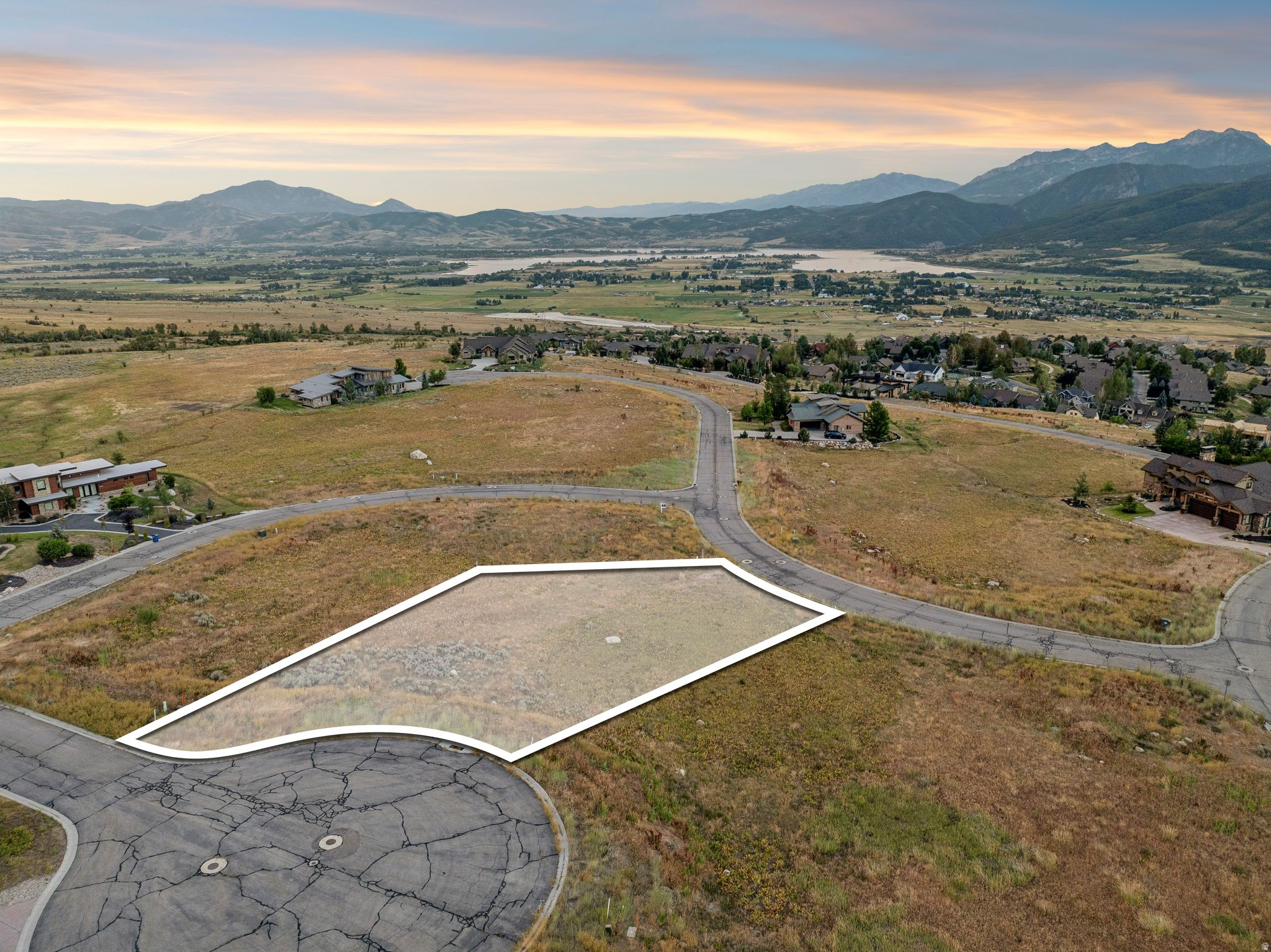 Build your custom home on this 0.47-acre cul-de-sac homesite in The Highlands at Wolf Creek, one of Ogden Valley's premier mountain communities. Positioned near the end of the cul-de-sac, the lot enjoys an open setting with expansive views across Ogden Valley, Pineview Reservoir, and the surrounding Wasatch Mountains. The gradual slope offers flexibility for a variety of home designs, and utilities are stubbed to the property, including culinary water, sewer, natural gas, and power. The Highlands is a thoughtfully planned community of 138 homesites with architectural design guidelines that help preserve the quality and character of the neighborhood. Residents are part of the Wolf Creek Resort community with access to nearby golf, trails, fitness amenities, and open space. Conveniently located just minutes from Powder Mountain, Snowbasin Resort, Pineview Reservoir, and year-round recreation, this homesite offers an exceptional opportunity to build in the heart of Eden. Buyer to verify all information, utility connection fees, building requirements, and community amenities.