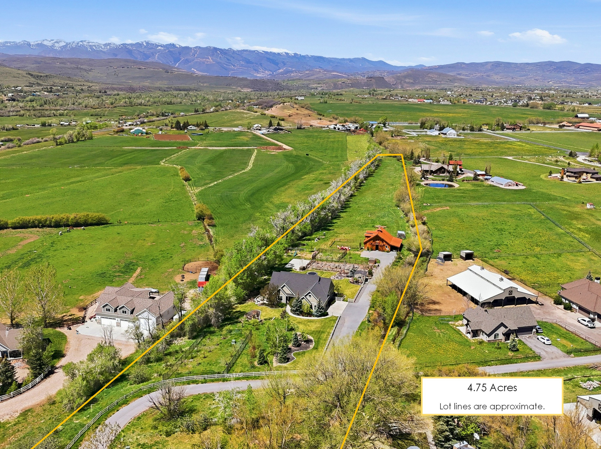 Beautiful 4.75 AC country estate loaded with amenities: radiant heat throughout the home, Amish style barn w/ 2 stalls, tack room, corrals, pastures, two fenced orchards, greenhouse, garden shed w/ water, fenced garden, playhouse, sports court, and more.