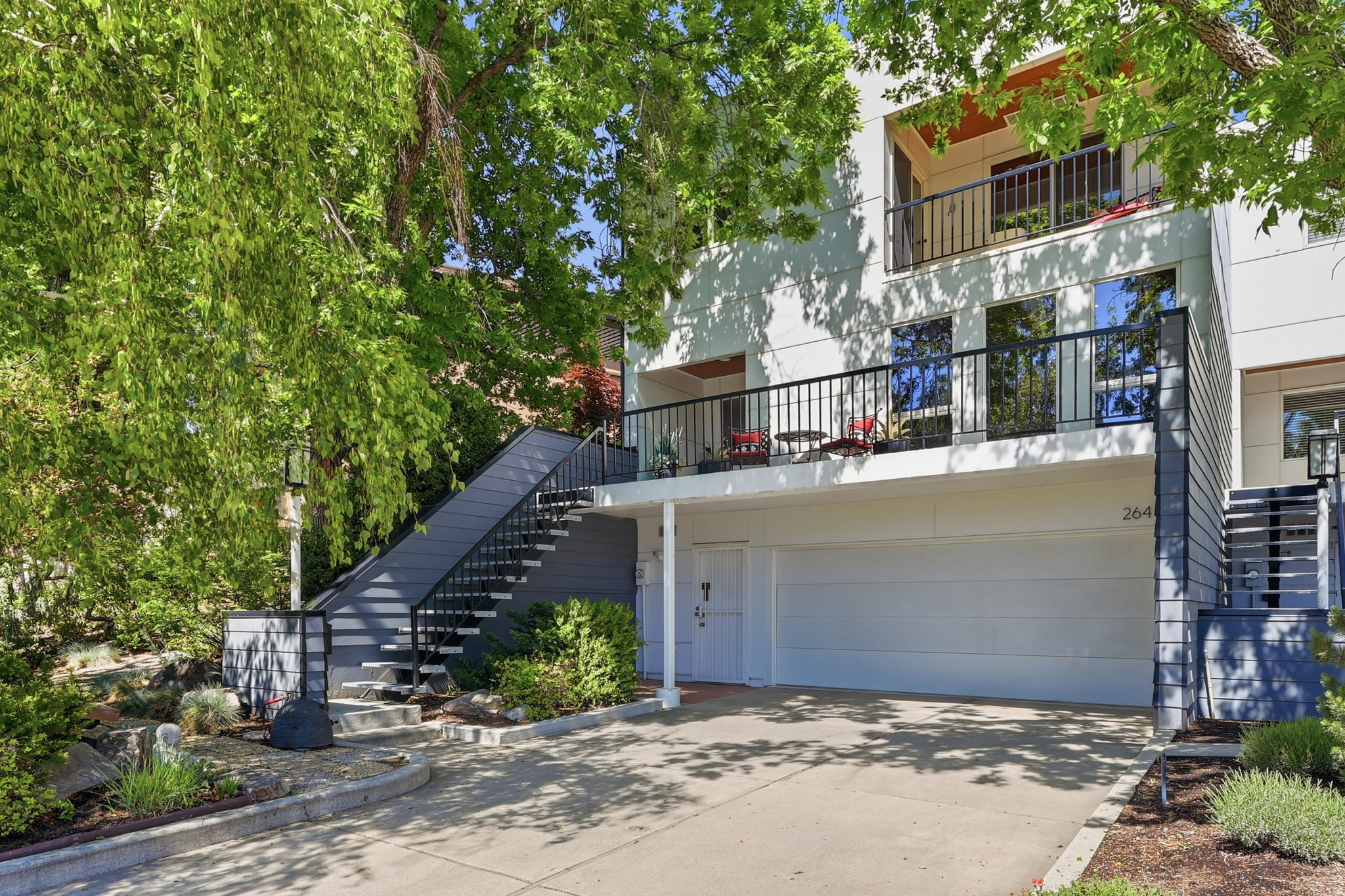 MULTIPLE OFFERS RECEIVED. This spacious townhome has it all! LOCATION: A block from the heart of downtown. Walk to Jazz games, Abravanel Hall, Broadway shows, and downtown restaurants. VIEWS: of downtown & the valley. PRIVATE serenity in a delightful garden - a world apart from the city bustle. LUXURIOUS light, open interior, tastefully designed. MODERN  kitchen, a dumb waiter that brings all your groceries to the kitchen. OPULENT primary suite with an en-suite bathroom & a walk-out deck with gorgeous views of downtown & sunsets. WELCOMING entry into a formal living & dining room with a fireplace & a wall of windows that capture cityscape views with an adjoining spacious deck for entertaining & relaxing. Oversized garage. Google Fiber internet, Secluded yard & patio make this home a relaxing sanctuary. * Spacious design * Gorgeous views * Modern living in historic area * Completely new exterior featuring modern design in an historic neighborhood. Don't miss this rare opportunity!
