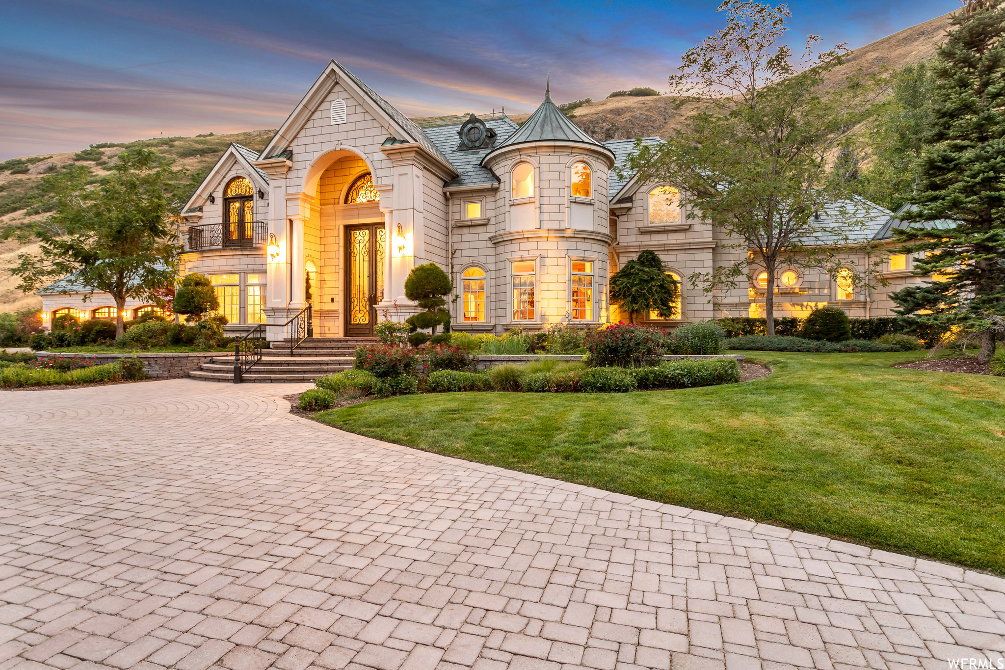Where European Elegance Meets Utah's Most Spectacular Views Tucked behind the gates of North Cove Estates, this exceptional French Chteau-inspired home offers a rare combination of elegance, privacy, and breathtaking beauty. Custom built with extraordinary attention to detail, every room reflects the craftsmanship and care that went into creating a truly one-of-a-kind residence. A grand entry welcomes you into thoughtfully designed living spaces that are both beautiful and inviting. The home features four spacious bedroom suites, a stunning library and music room, an elegant formal dining room, and a gourmet kitchen designed for gathering with family and friends. An elevator provides easy access to all three levels, while radiant heated floors and zoned heating and cooling ensure year-round comfort. One of the home's most remarkable features is its setting. From nearly every window, you'll enjoy incredible views-from the Wasatch Mountains to the east to the peaceful gardens and water features that surround the property. The backyard feels like a private retreat, with lush landscaping, mature trees, and the soothing sounds of flowing water creating a sense of calm rarely found so close to the city. The lower level offers room to grow, with space already planned for a fifth bedroom suite and a large theater room. Whether hosting guests or simply enjoying a quiet evening at home, this property offers the perfect balance of luxury and livability. Located just minutes from downtown Salt Lake City, Salt Lake International Airport, and Utah's world-class ski resorts, this is a rare opportunity to own one of the finest homes in North Cove Estates.