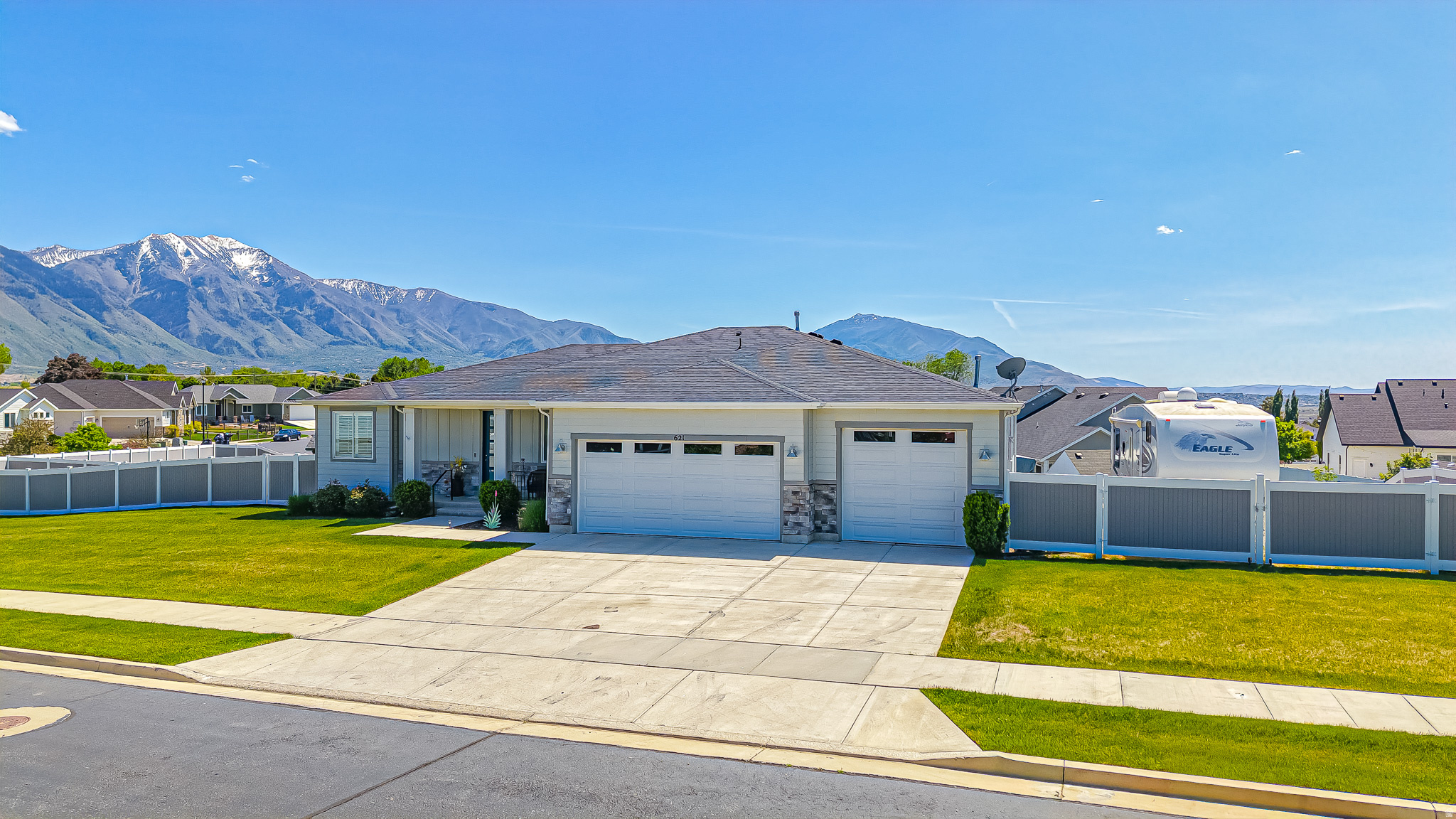 *Click the "tours" button for 3D tour* Immaculately maintained home in one of Spanish Fork's most sought-after neighborhoods! Situated on a rare, half acre lot with full landscaping and stunning mountain views, this beautifully cared-for property offers the perfect blend of comfort, space, and future potential. The main level features 3 spacious bedrooms, an office, generous living space and an expansive primary suite. The primary bath is a true retreat, complete with dual vanities, a large soaking tub, separate shower, and an oversized walk-in closet. The unfinished walkout basement complete with 9' ceilings gives you room to grow and the opportunity to create a space truly tailored to your needs. Outside, enjoy the tranquility and privacy of a fully landscaped and fenced yard with plenty of room to relax, entertain, or play while taking in the surrounding views from your covered deck. One of the standout features is the oversized heated 4-car garage-a rare find with ample room for vehicles, toys, hobbies, or storage-plus generous RV parking for all your adventure needs. The full walkout basement with separate exterior stair access offers incredible flexibility and is ideal for a future accessory dwelling unit (ADU), mother-in-law apartment, or rental opportunity.