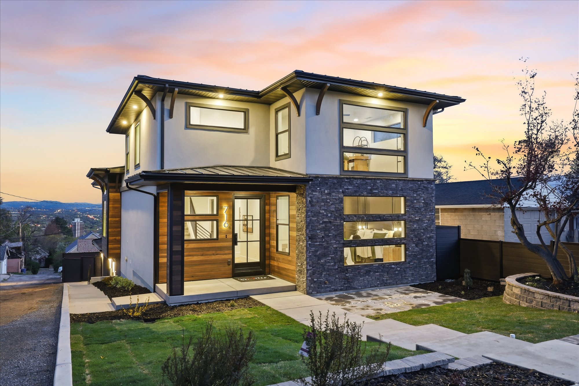 Modern luxury in The Avenues. This stunning new build by Hickory Tree REI blends modern styling with Craftsman character and unforgettable views. An open-concept main level with 12-foot ceilings and walls of windows that capture sweeping vistas from the mountains across the valley and into the city. The main-floor primary bedroom offers a spa-inspired bath with a stand alone tub & steam shower, creating the perfect private retreat.  The walk-out lower level (mostly above grade) with 9-foot ceilings creates a bright, expansive living space that never feels like a basement. And the crown jewel? A massive deck with built-in BBQ, room for a hot tub, and panoramic views that stretch for days.  Square footage figures are provided as a courtesy estimate only and were obtained from building plans .  Buyer is advised to obtain an independent measurement.  Owner/Agent
