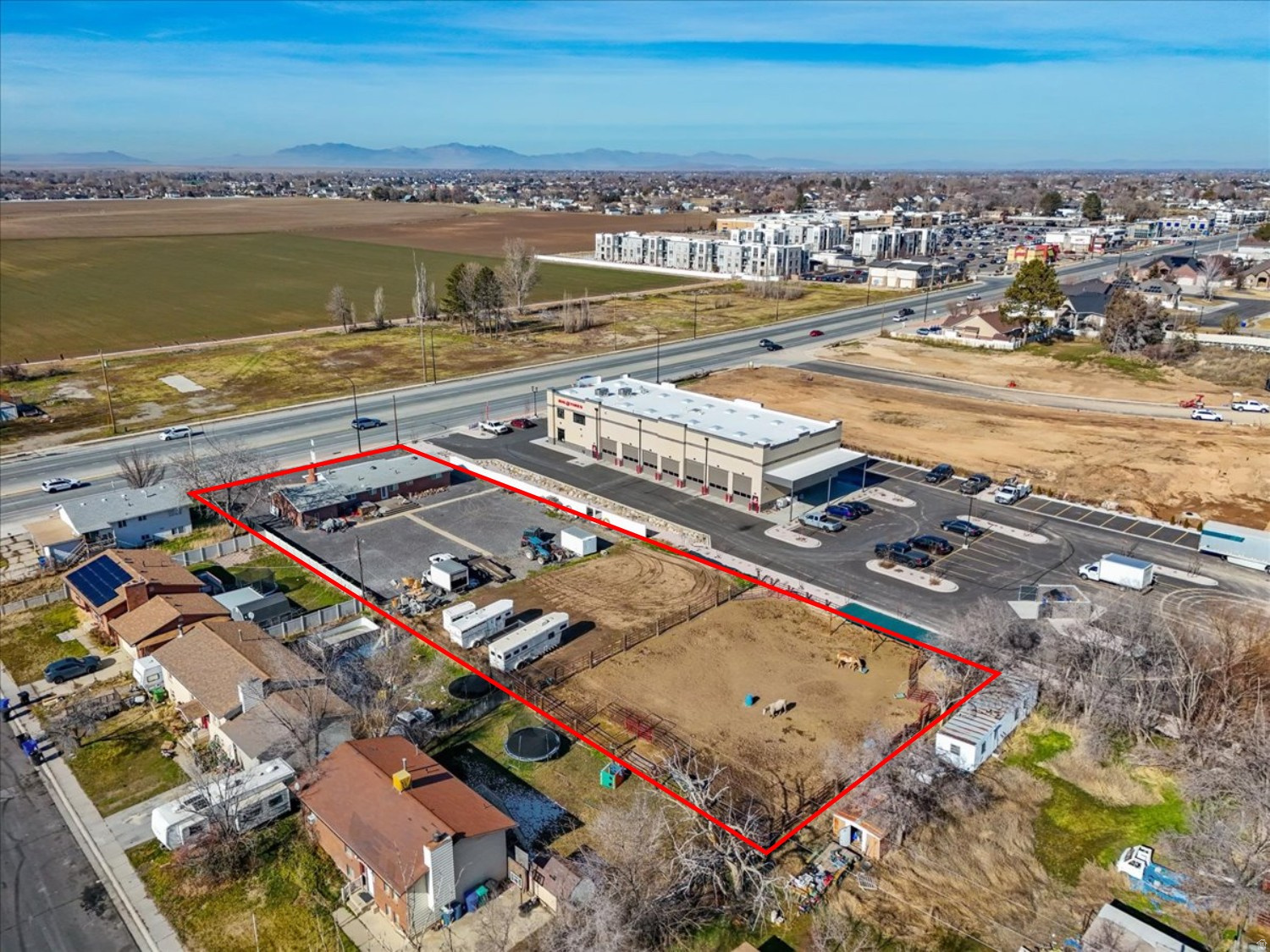 For sale or lease! This exceptional 1-acre parcel is ideally positioned along 2000 West in West Point, one of Davis County's fastest-growing submarkets. The property offers outstanding visibility and frontage on a major arterial road carrying approximately 30,000 vehicles per day, providing strong exposure and brand presence for a wide range of residential or commercial uses. For commercial users, neighboring zoning C-C and N-C Commercial allows for office, retail, restaurant, or mixed-use development. For residential users, current zoning R-2 and general plan zoning R-3 allow for multiple units with or without commercial accompanying. Surrounded by established businesses and residential uses, and the rapid ongoing growth, the property benefits from consistent traffic, strong local demographics, and proximity to key transportation routes connecting West Point to the greater Davis and Weber County markets. With its combination of high traffic counts, excellent accessibility, and flexible development potential, this parcel represents an outstanding opportunity to secure a premier location in a rapidly-expanding market! Parcel is being offered as development ground, assuming the removal of the existing structures. Ground lease negotiable.