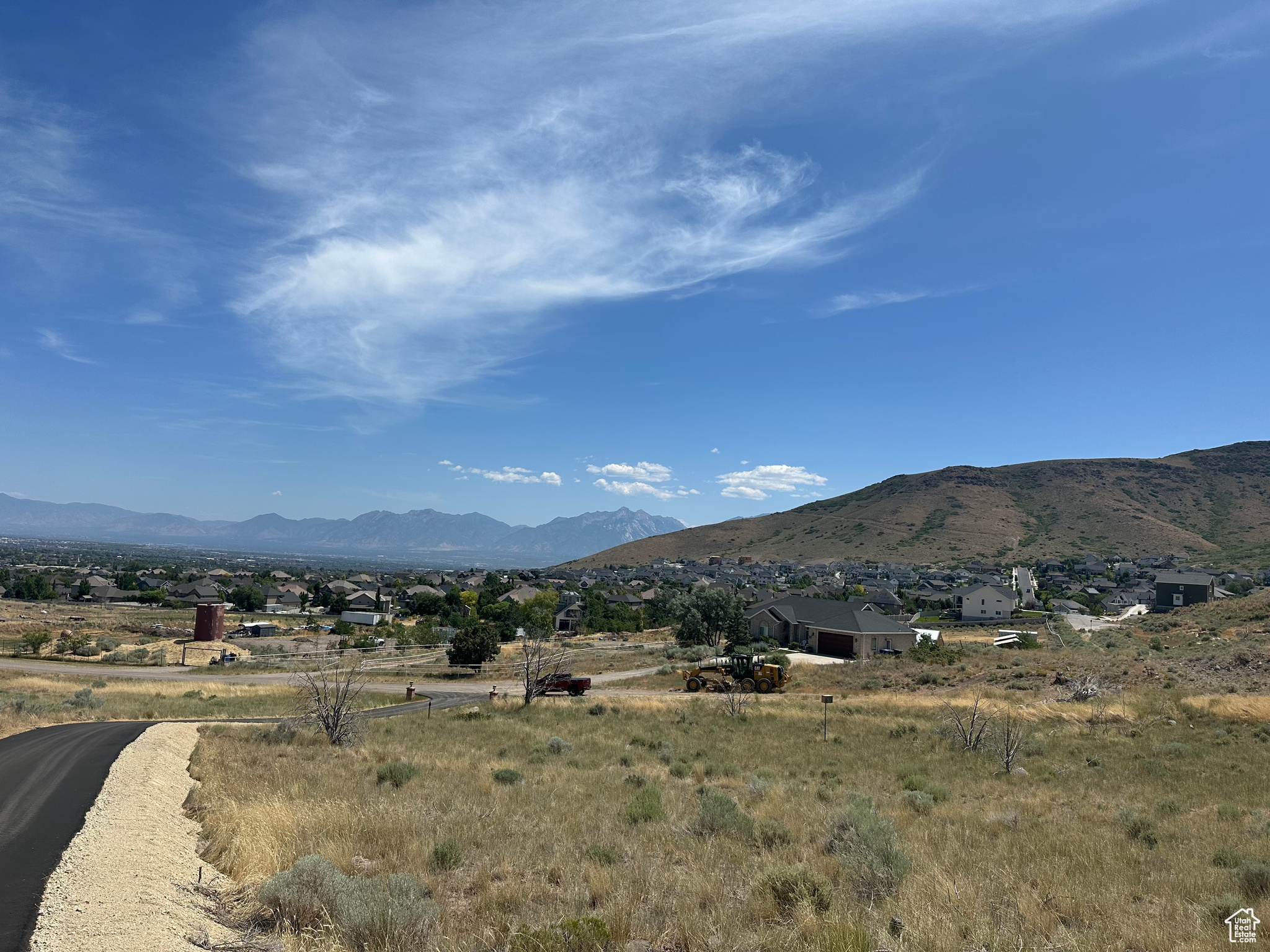 Rare Opportunity in Herriman! This stunning 5-acre lot offers peaceful country living with unbeatable mountain and valley views in every direction. Whether you're looking to build your dream estate or develop the property, this parcel offers incredible potential-zoned to allow up to five 1-acre lots. Enjoy the beauty of rural living without sacrificing convenience, just minutes from shopping, schools, and amenities. Don't miss your chance to own a piece of Herriman's scenic landscape with endless possibilities! Buyer is responsible for bringing utilities to the property and contacting Herriman City to create any new zones necessary to subdivide the property.  DISCLAIMER: the drawings of the lot lines on photos are estimates only. Buyers to verify all boundaries and easements and all information with Herriman City.