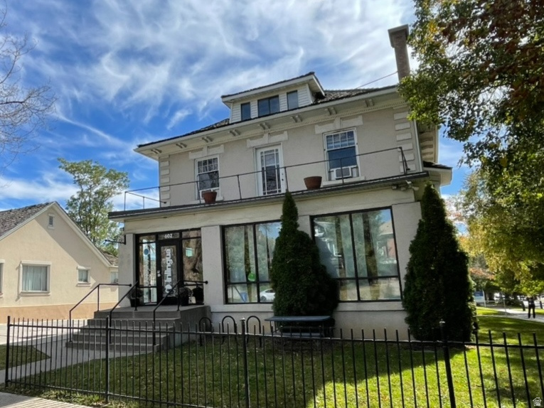 Discover a rare chance to own this Italianate office & apartments conversion in the Central City Historic District, originally constructed in 1911 as a single family mansion and thoughtfully adapted for modern commercial use. This timeless property blends architectural character with urban functionality. Classic features such as original woodwork and fireplaces, soaring ceilings, and abundant natural light create an inspiring environment perfectly suited for office, retail, creative workspaces, or potential live/work configurations.  ***  Positioned in a highly walkable and visible corridor, the property sits just steps from TRAX, top dining, entertainment, Trader Joe's, and boutique shopping. Its central location provides quick access to the University of Utah, three major hospitals, Downtown SLC, and key transportation routes. A private parking lot with generous off street parking further enhances day to day convenience. The "hard corner" location at 600 East and 300 South - combined with RMF35 zoning and the fact that the building is within the historic district but not designated historic - offers compelling future redevelopment potential for this unique property.