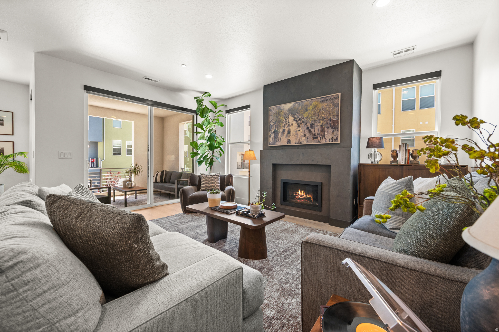 GRAND OPENING, SAT, JULY 25TH 11-1. You're obsessed. Just when you thought that home with all the too-good-to-be-true details only existed in your Instagram saved folder... along comes 1498 Aspen Ridge Lane. Better than new, this designer-finished townhome doesn't just check every box... it rewrites the list. Fully upgraded through the builder, then the owners took it even further with custom roller shades, a jaw-dropping full-height European tile backsplash, Roman clay fireplace surround, custom lighting, wallpaper, and thoughtful storage solutions. Cathedral-height ceilings, an executive-style primary suite, and a fully covered deck make this townhome live like a dream. The kitchen is made for equal parts gazing and gathering, with ceiling-height cabinetry, a gas range, textured quartz countertops, and a separate pantry. The open-concept main level was designed for entertaining and everyday living alike. Located just minutes from Station Park, premier shopping and dining, parks, FrontRunner, and convenient freeway access, you'll love having everything you need within easy reach. Skip the design center. Someone with exceptional taste already did the hard part.