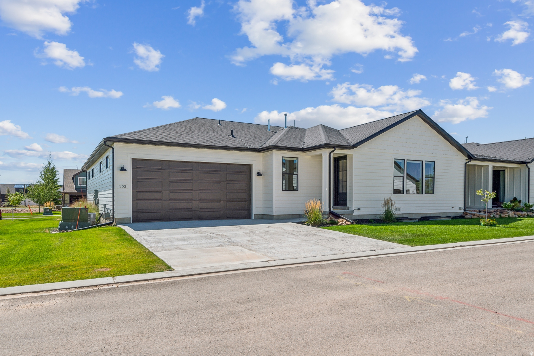 This home offers true lock-and-leave living with snow removal and lawn maintenance in a quiet, 55+ community in BETTER THAN NEW CONDITION! Spend your days hiking in the nearby Uinta Mountains, biking endless trails, or skiing world-class slopes. Perfectly located for walkability and effortless access to the outdoors and maintenance-free comfort. Just a short stroll from Main Street and the South Summit Aquatic & Fitness Center, featuring a top-tier gym, lap pool, fitness classes and a leisure pool the grandkids will love. Park City is an easy trip away thanks to the free bus system that delivers you right into town. Inside, the home is filled with natural light and smart single-level living with top-down-bottom-up blinds. The spacious Primary Suite sits privately on one end of the home, with a second bedroom, perfect for guests or a home office, on the other. A large kitchen and airy great room open to a covered patio, ideal for outdoor dining or soaking in the surrounding mountain views. The lower level is already framed with plumbing and electrical in place, making future expansion a breeze. An oversized garage and extra-tall garage door offer generous storage for ATVs and gear, everything you need for the endless outdoor adventures just outside your front door. Ideal rental property purchase for the upcoming Olympics.