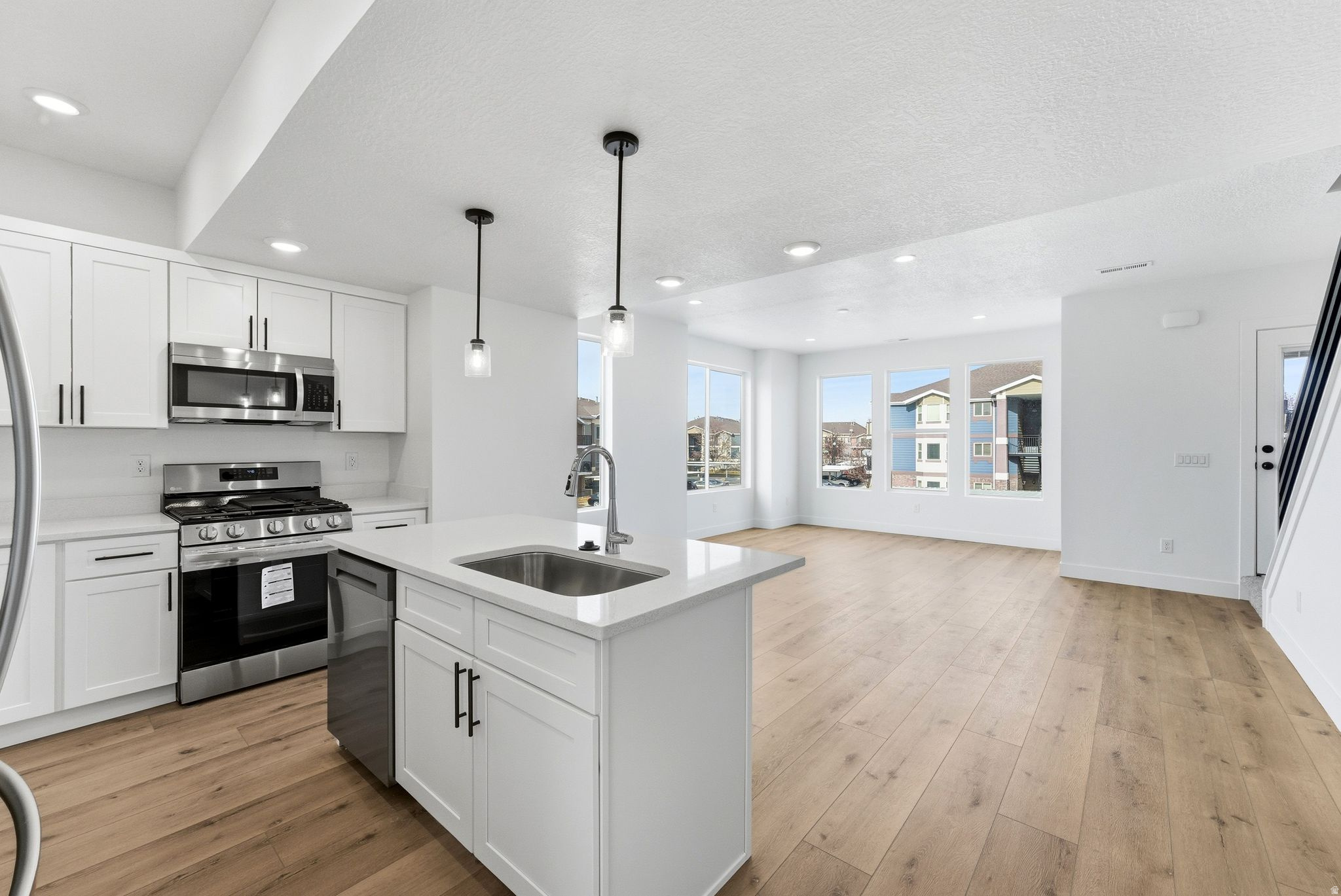 Exciting Opportunity: Final 5 Units Available! Stunning New Construction Townhomes in Sought-After Sandy Location!   Discover the perfect blend of modern living and convenience at five brand-new townhomes nestled in a vibrant neighborhood, just a stone's throw from the bustling heart of Midvale. With easy access to I-15, commuting to Salt Lake City or the surrounding areas becomes a breeze, making it an ideal spot for professionals and families alike. These thoughtfully designed townhomes boast spacious open-concept layouts, filled with natural light and finished with high-quality materials. Enjoy contemporary kitchen designs with stainless steel appliances, elegant countertops, and ample storage, perfect for both everyday living and entertaining. Each unit offers comfortable bedrooms, stylish bathrooms, and a private outdoor space-ideal for relaxing after a long day. This is the last chance to own one of these exceptional townhomes, as they are the final five units remaining in this massive development project. Don't miss out on your opportunity to secure your home in this thriving community! The property features an array of amenities that enhance your lifestyle. Take advantage of the fenced dog park, where your furry friends can play freely, or get active on the pickleball and basketball courts. For those with a green thumb, rentable vegetable boxes are available to cultivate your own garden, fostering a sense of community and sustainable living. Located in a rapidly growing area, you'll find an abundance of shopping, dining, and recreational options nearby. Enjoy the convenience of local grocery stores, trendy cafes, and diverse restaurants just minutes away. For outdoor enthusiasts, the stunning Wasatch Mountains are within easy reach, offering hiking, skiing, and a plethora of year-round activities. Whether you're looking for a new home or a smart investment opportunity, these low-maintenance townhomes combine comfort, style, and an unbeatable location. With these final units available, now is the time to schedule your showing and secure your place in this exciting new community. Don't miss out on the chance to be part of this flourishing neighborhood-act fast before they're gone!
