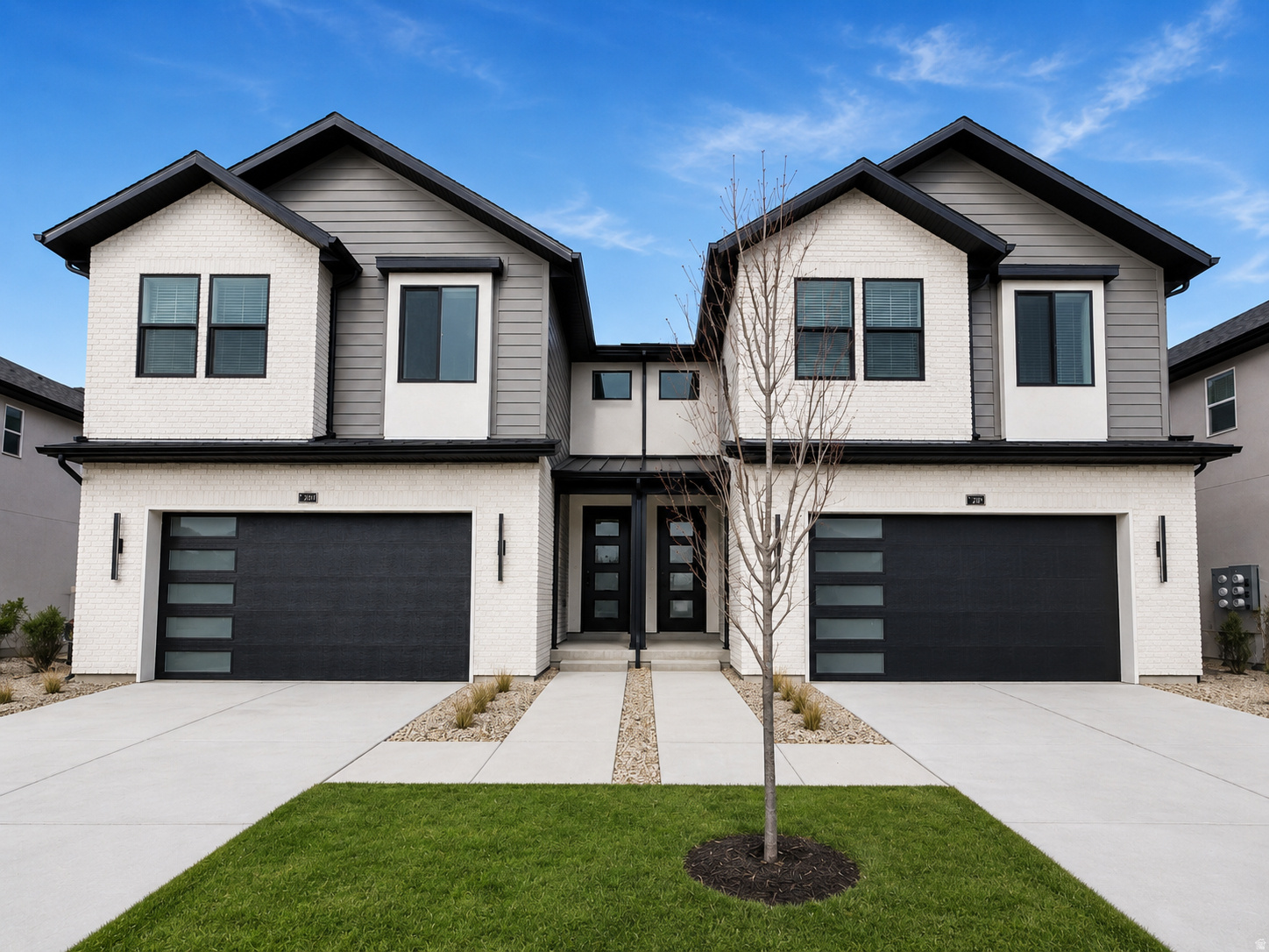 New construction at Trailside Reserve. Twin home that lives like a single family home with open great room, fireplace insert, quartz countertops, under cabinet lighting, included blinds, fully fenced backyard, EV charging port, and full unfinished basement. Brighton Traditional design package with 9' ceilings on the main level, Low E double pane windows, composite decking, 95% efficient furnace, and 7 layer sound protection. Model home open Mon-Sat 12 PM to 6 PM at 6760 S 300 E, Midvale. Virtually staged. Photos may vary by unit and may show a similar home with the same finishes.