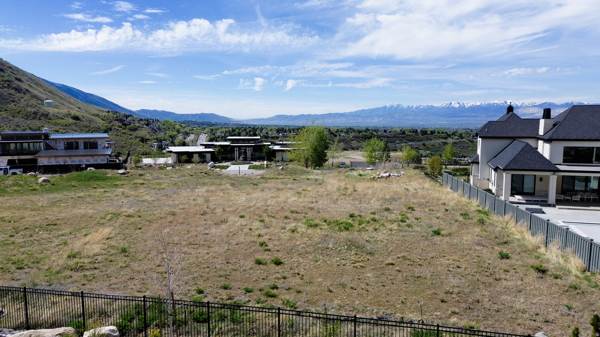 Nestled at the breathtaking entrance of Big Cottonwood Canyon, this premier homesite in the exclusive Tavaci community presents an incredible opportunity to create a legendary property. Hidden behind private gates and enveloped by stunning mountain vistas, this .63-acre lot offers a perfect blend of seclusion and effortless access to all the wonders Salt Lake City has to offer.  Imagine waking up to towering canyon walls, fresh alpine air, and endless outdoor adventures just minutes away. Whether you're a skiing enthusiast, hiker, or someone who loves escaping the summer heat, this location puts exhilarating experiences right at your doorstep, while still being only a short drive to the city.  Tavaci is celebrated for its luxury, privacy, and striking architecture. This lot provides a blank canvas to design a custom estate that reflects the community's high standards. If you've been dreaming of a lot that makes people say, "I wish I had this life," this is your moment. Build something unforgettable in one of Utah's most highly coveted canyon communities.