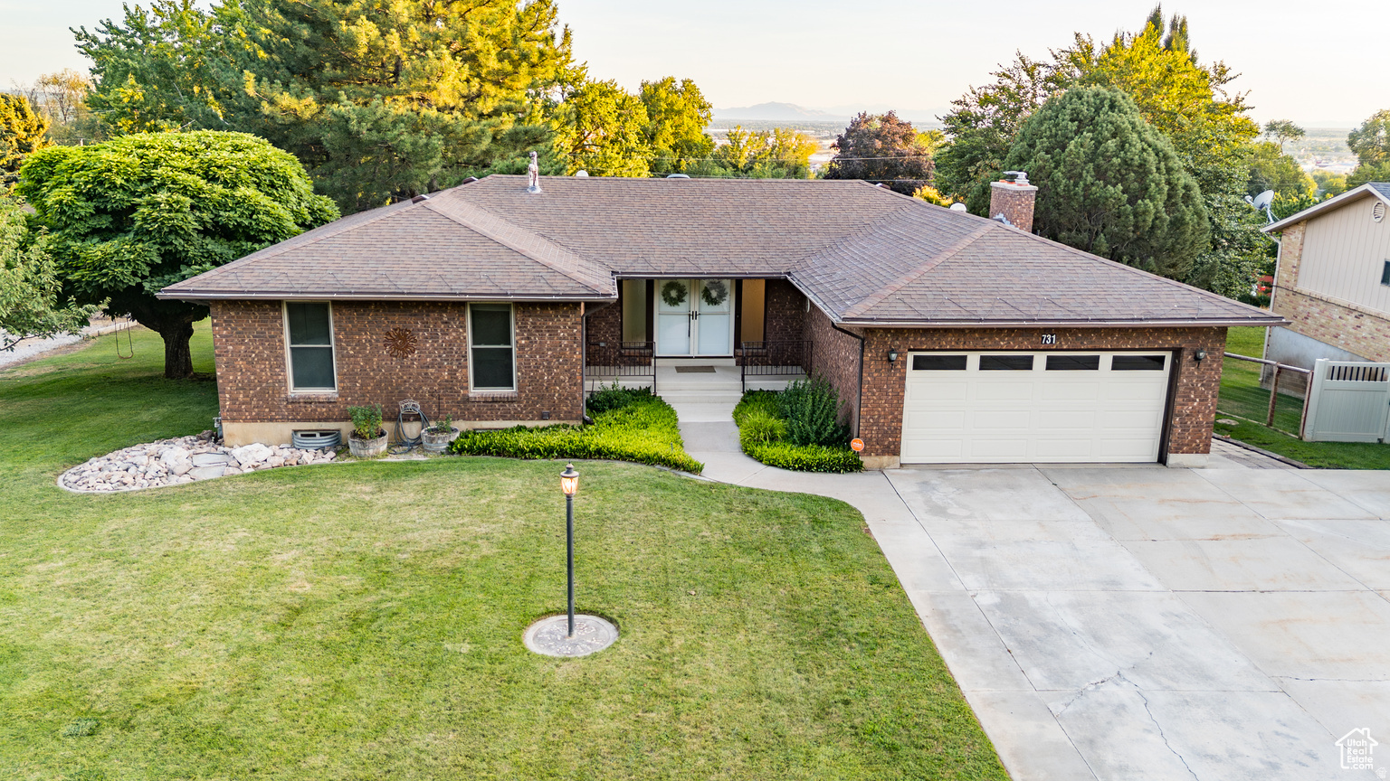 Welcome to this all brick, stunning rambler in one of Pleasant View's most desirable neighborhoods, offering breathtaking mountain and valley views. With over 3,500 square feet, this home features 6 bedrooms, 3 bathrooms, and the convenience of laundry on both levels. The completely remodelled kitchen with real cherry wood cabinets, opens to comfortable living spaces, including a formal living room with real walnut crown, perfect for entertaining or relaxing. The walk-out basement boasts a spacious family room with plenty of space where a second kitchen could easily be added-ideal for guests or potential rental income. Step outside to a large covered deck where you can entertain or simply unwind while soaking in the city views. Enjoy peace of mind with paid-off solar panels and an oversized generator, ensuring you're never without power. Sitting on over a half-acre, this property offers ample storage inside and out, giving you room to spread out and enjoy this quiet corner of Utah.