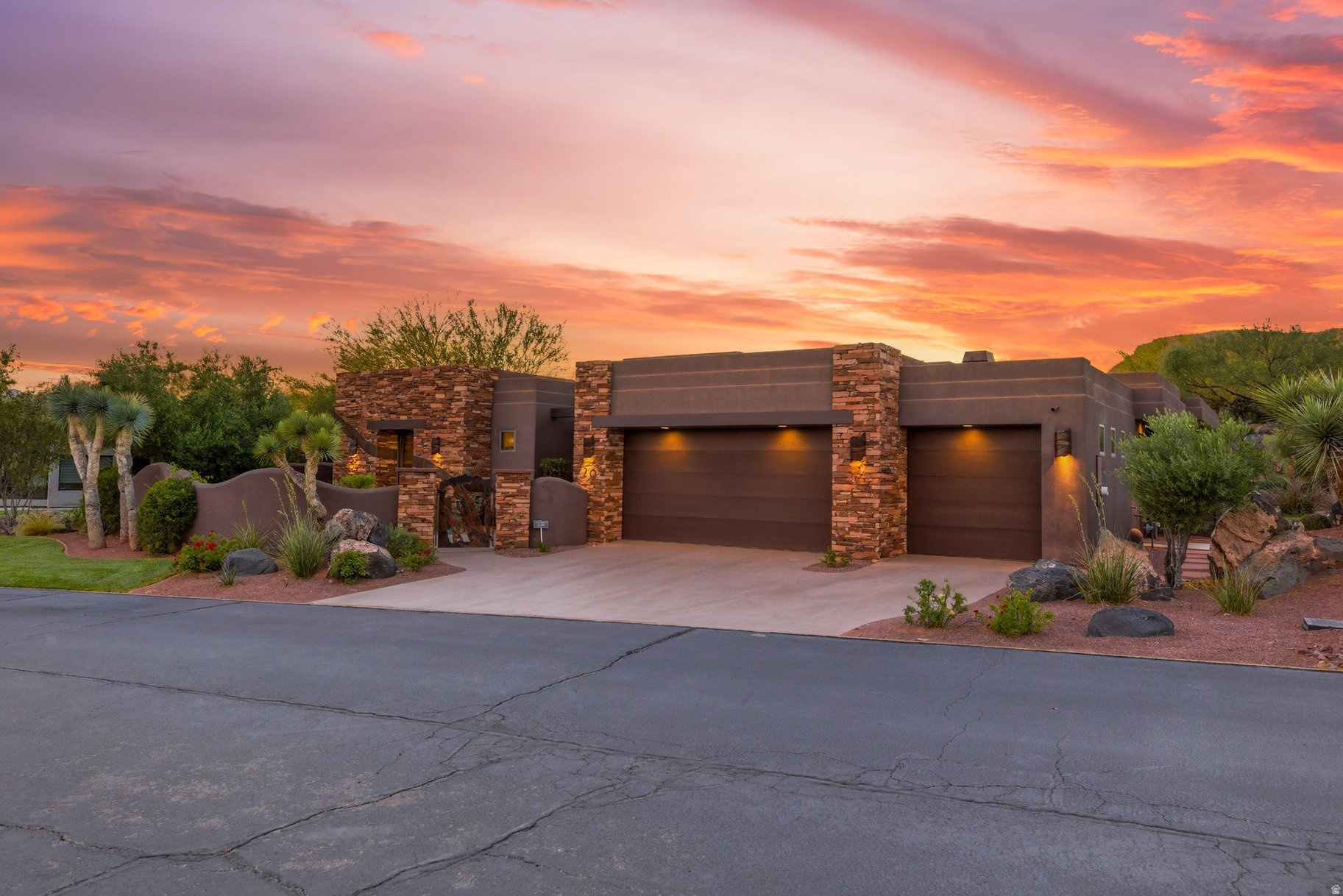 Situated within the prestigious gated community of The Reserve at Entrada, this exceptional luxury residence offers an extraordinary blend of privacy, elegance, and breathtaking desert beauty. Built in 2007, the 3,894-square-foot estate is thoughtfully designed to capture stunning red rock views while creating a serene retreat both indoors and out.  The home features three spacious en-suite bedrooms, a beautifully appointed powder room, and a private office complete with hidden storage concealed behind a custom, glass shelved bookcase. Rich African mahogany cabinetry is showcased throughout the home, complementing the warm architectural details and timeless craftsmanship.  Expansive floor-to-ceiling windows flood the interiors with natural light and seamlessly connect the living spaces to the surrounding landscape. Three indoor fireplaces create an inviting atmosphere throughout, while the chef's kitchen is enhanced by a functional butler's pantry designed for effortless entertaining.  The primary suite serves as a private sanctuary, featuring a luxurious steam shower, therapeutic air tub and a separate laundry area conveniently located within the closet.  Outdoor living is equally captivating. The private backyard is centered around a tranquil pond with two beautiful waterfalls, creating a calming ambiance alongside the in-ground jacuzzi, built-in outdoor BBQ, and cozy gas fire pit. In the front and side courtyards, two elegant water fountains welcome guests with timeless sophistication.  Combining refined luxury, unmatched privacy, and iconic Southern Utah scenery, this remarkable residence offers an elevated lifestyle in one of the area's most exclusive communities with access to the prominent Entrada Golf Club.  Please allow 2 hour notice prior to showings.