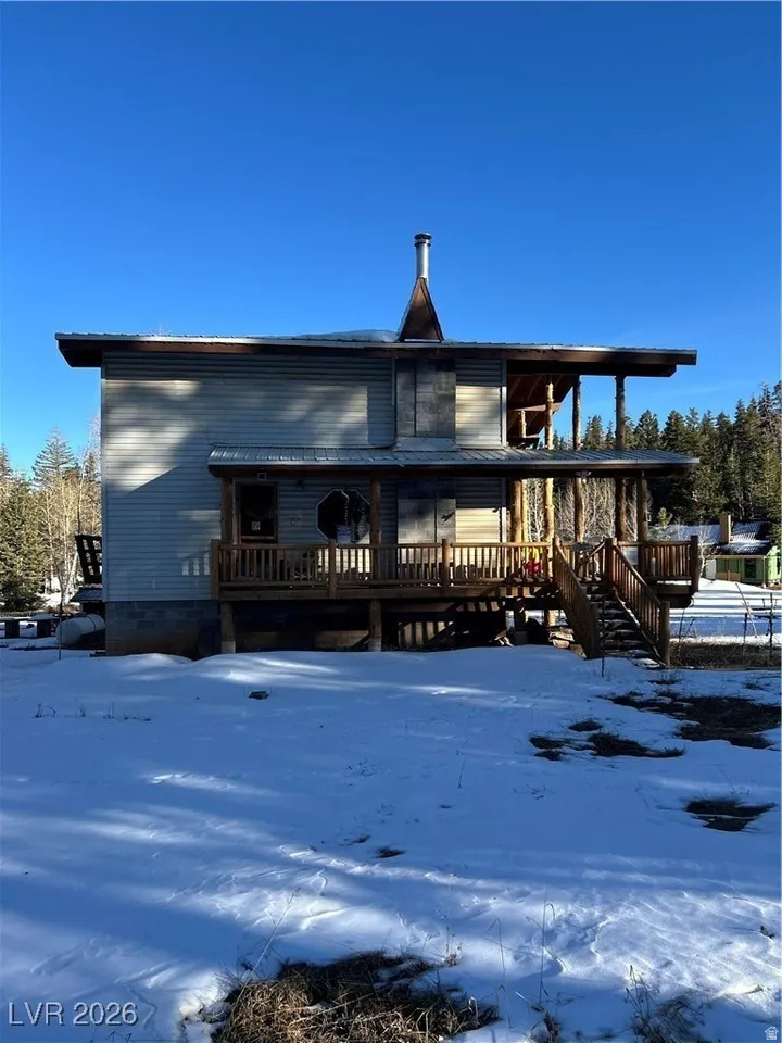 Spacious mountain cabin in Zion View Mountain Estates featuring 4 bedrooms and 2 full bathrooms on a .45-acre lot. Includes a fully functional kitchen, laundry room, attached garage, and walk-out basement. Large decks and balcony with beautiful mountain views, plus RV parking.