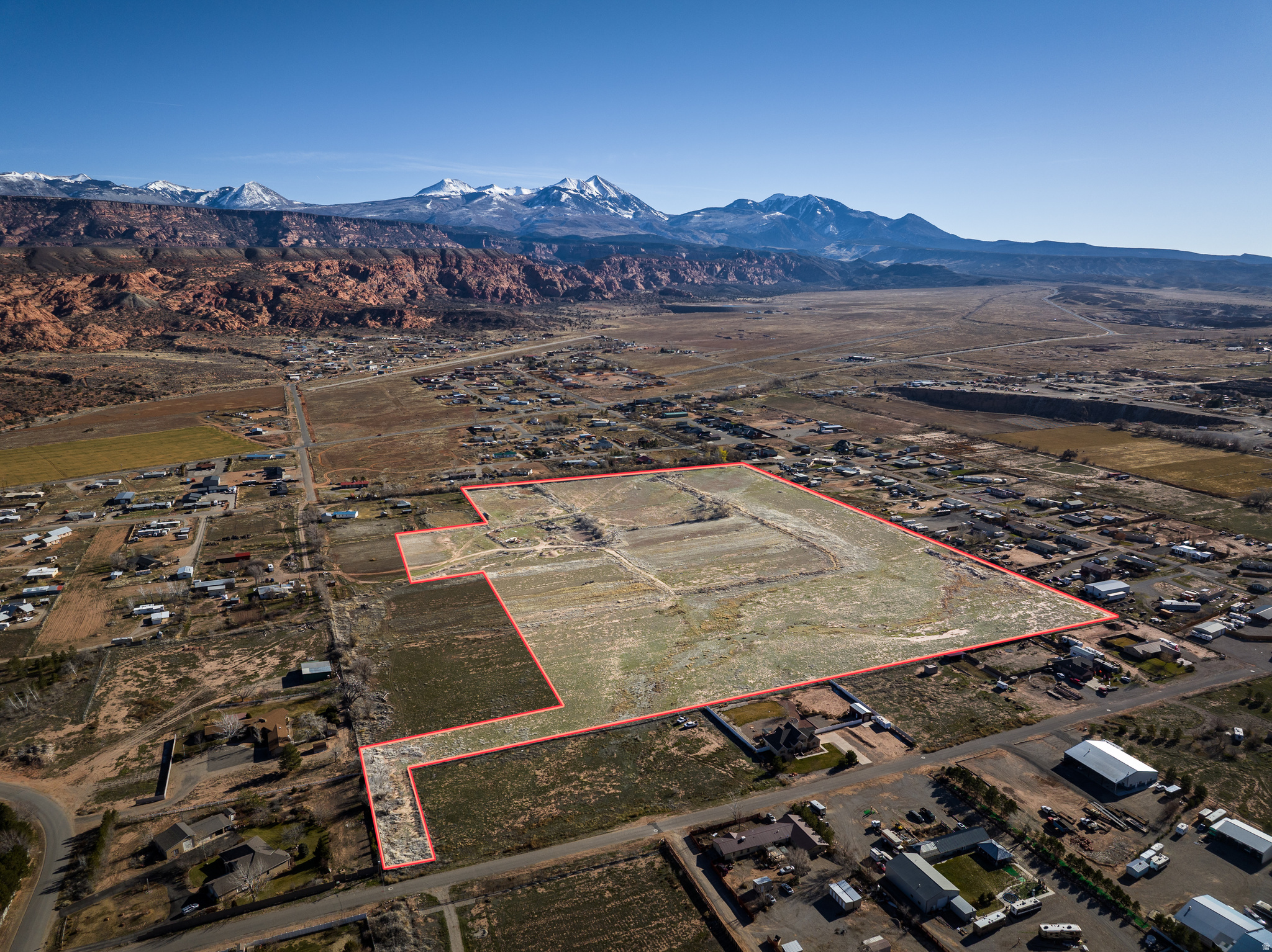 BUILD YOUR COMMUNITY- This 35-acre parcel of gorgeous developable land is a blank slate to create your desirable neighborhood.  Set under the Moab Rim with direct views of the La Sal Mountains, this site has potential for density housing, larger ranchettes, or keep it all for yourself for your private ranch.  Accessible from Tera Drive, as well as West Coronado, the potential for neighborhood thoroughfare and connectivity is in place.  Water, sewer, power, and fiber optic cable are available from multiple locations allowing for ease of design.  Dream it, design it, build it- here in Moab's Spanish Valley.