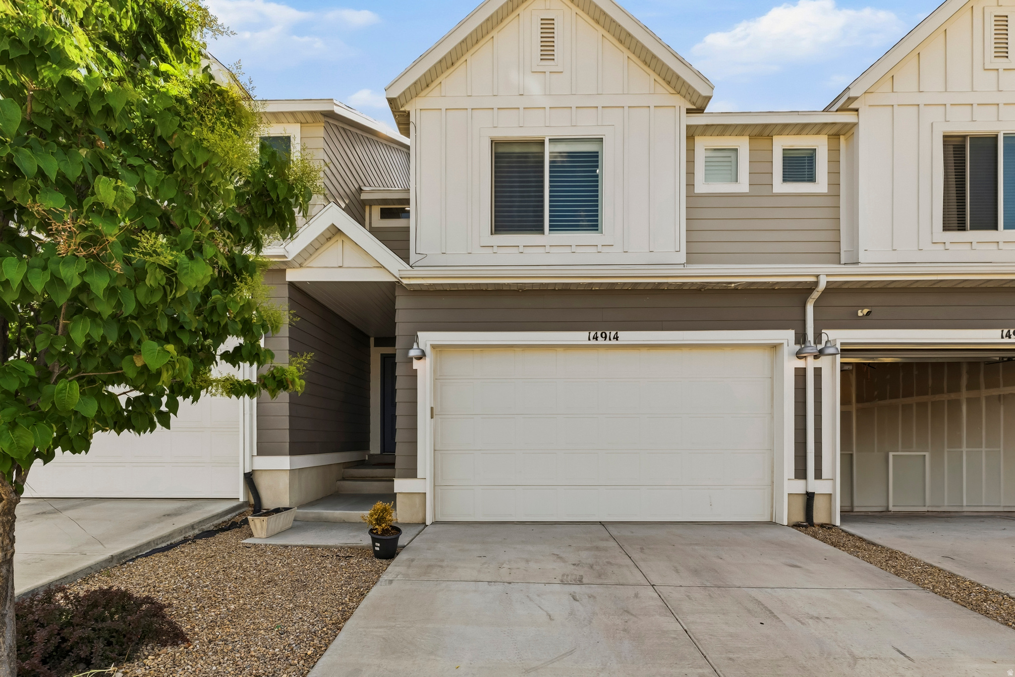 PRICE IMPROVEMENT! Discover exceptional value in this beautifully maintained Herriman townhome featuring over 2,200 square feet of thoughtfully designed living space. Built in 2019, this home offers modern finishes, abundant natural light, and a versatile layout perfect for today's lifestyle. The open concept main level showcases a stylish kitchen with quartz countertops, stainless steel appliances, a gas range, oversized island, and ample storage, main level was recently (2025)upgraded with durable luxury vinyl plank flooring, replacing the original carpet and adding a modern, low maintenance touch to the home's open concept design, making it ideal for both everyday living and entertaining.  Upstairs, you'll find a spacious primary suite complete with dual walk-in closets and a private bathroom, along with two additional bedrooms and convenient upstairs laundry. The fully finished basement adds incredible flexibility with a large family room, wet bar, and bathroom. Perfect for entertaining, a home office, guest space, or multi generational living.  Additional upgrades include plantation shutters, smart home features, security system, epoxy garage flooring, built-in garage storage, and a private fenced patio ready for summer BBQs. Conveniently located near shopping, dining, parks, walking trails, schools, Mountain View Corridor, and I-15, with exciting future development planned nearby. This move in ready home offers space, functionality, and value all in one package.