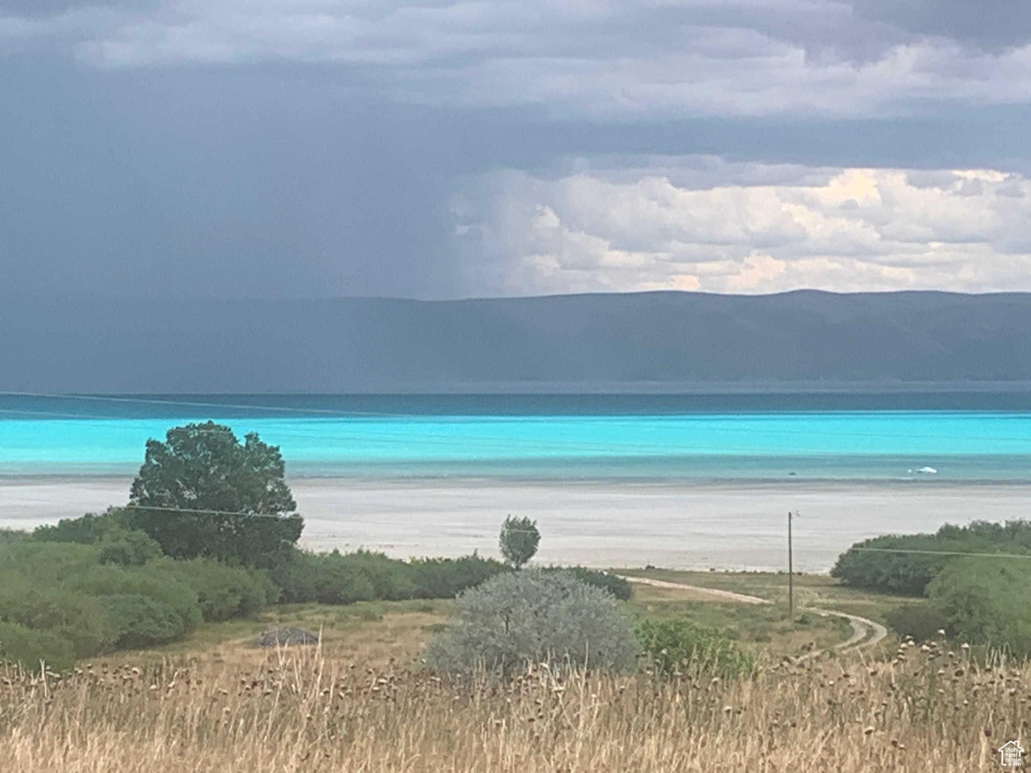 BEACHFRONT ACREAGE--ST CHARLES IDAHO. 3.92 acres, 161' beach front, NO HOA, excellent beach, seller to drill well, power and sewer will be put in.  Seller will also be making road improvements and be putting in a private gate.  Amenity membership to Seven Mile Ranch included. www.sevenmileranchbearlake.com Great property for vacation home/short term rental, family retreat, or permanent residence.