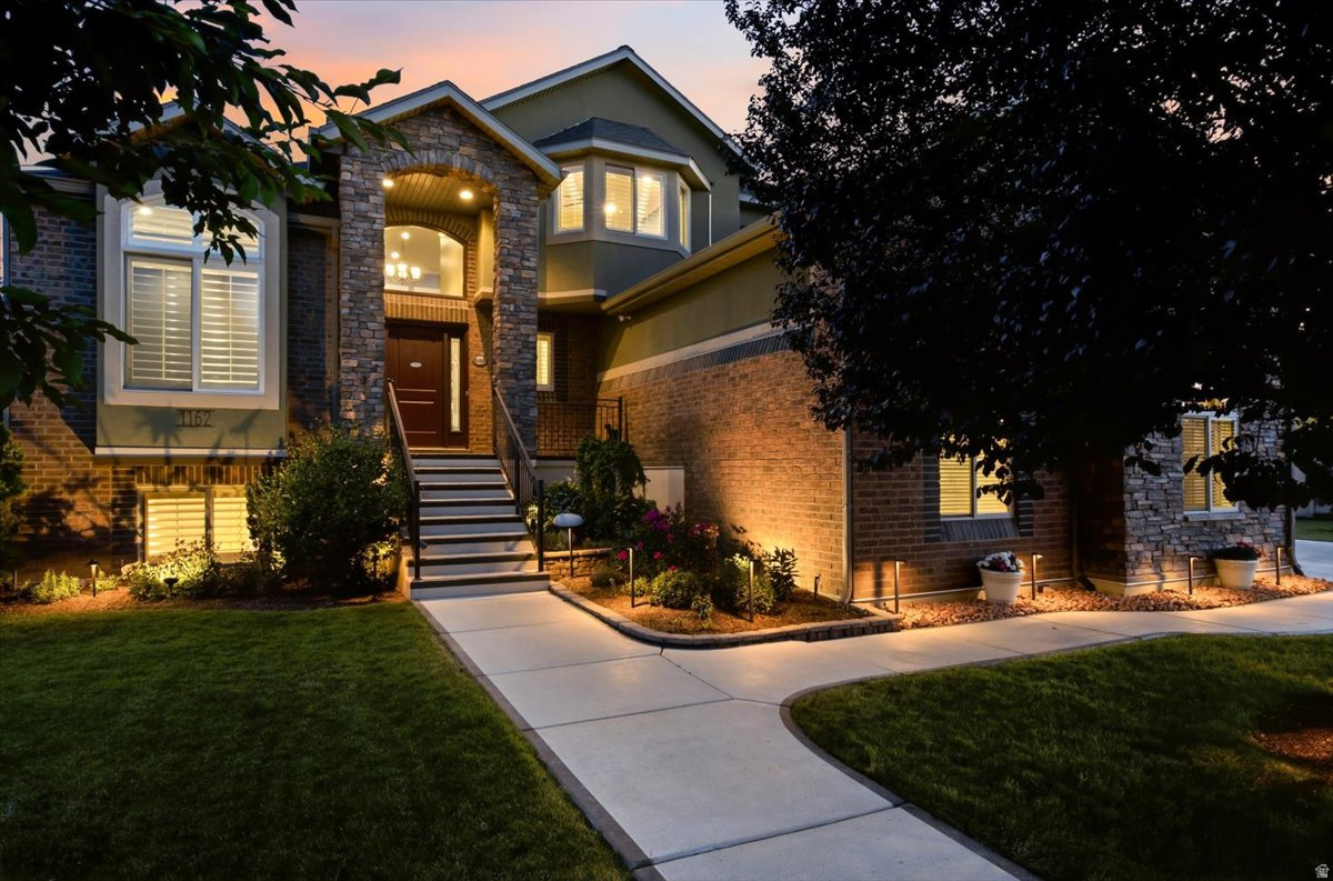Every once in a while, a home comes along where the level of care is immediately evident. This is one of those homes. Nestled in the pristine Highlands at Glen Eagle community, just moments from Glen Eagle Golf Course. What truly sets this home apart is the extraordinary pride of ownership. For nearly two decades, the sellers have meticulously improved, remodeled, upgraded, and maintained virtually every part of the property. From the new roof, remodeled kitchen with custom pull-out cabinetry, beautifully renovated bathrooms, luxury flooring, Pella windows and sliding glass door, Tesla EV charger, whole-home surge protection, and mini-split cooling systems upstairs, to the beautifully landscaped backyard with new sod, gazebo, fire pit, and outdoor entertaining space-every improvement was made with quality and longevity in mind. The spacious walkout basement is approximately 60% finished and offers tremendous flexibility with an additional bedroom, full bath, office, and abundant unfinished space that could easily accommodate a future apartment, home theater, gym, or additional living area. Conveniently located just minutes from West Davis Corridor, the brand-new Costco, shopping, restaurants, parks, schools, and commuter routes, you'll enjoy the perfect combination of peaceful neighborhood living and everyday convenience. Homes that have been cared for this meticulously rarely become available. Come experience the difference for yourself.