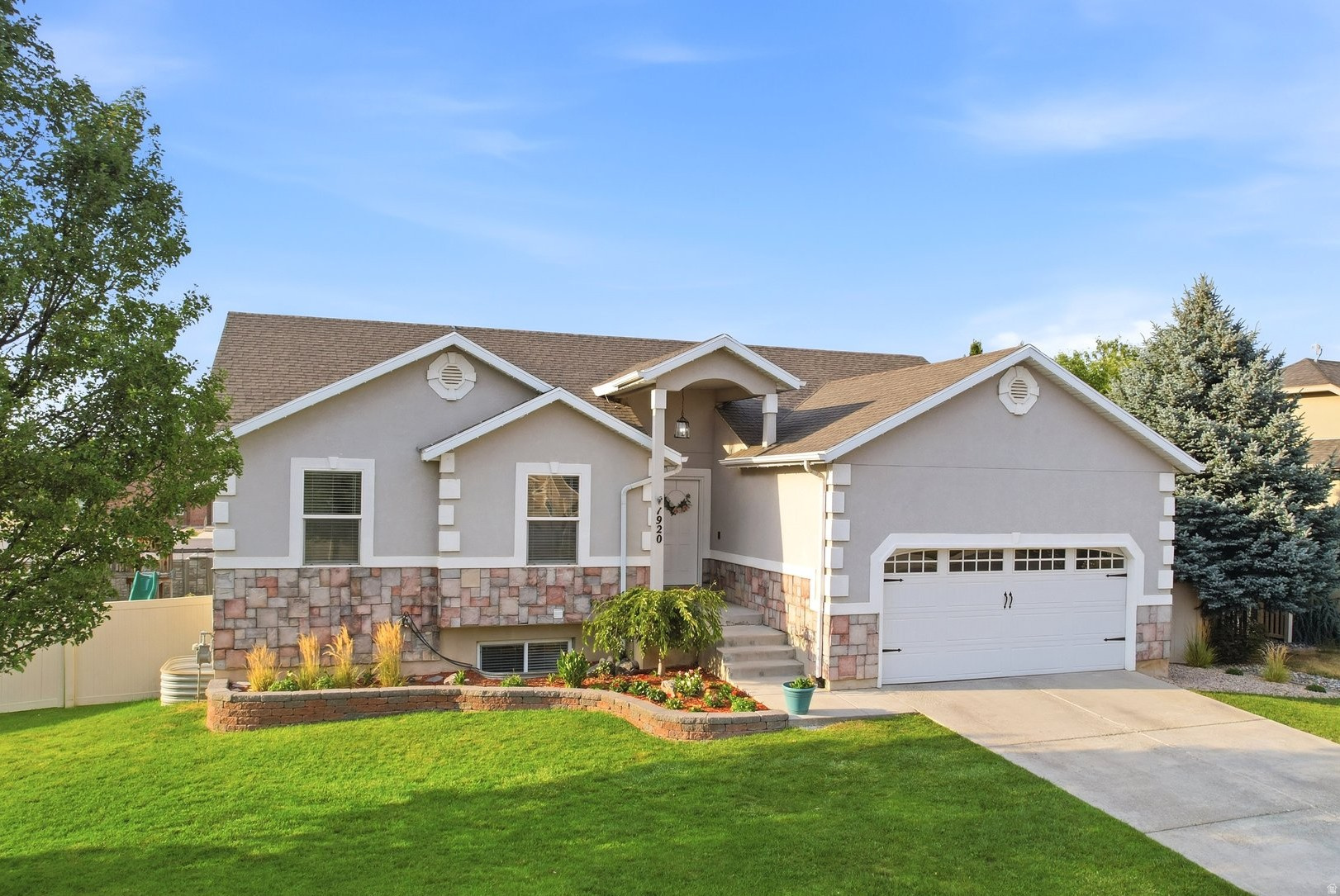 Welcome to this beautifully maintained 6-bedroom, 3-bathroom home on a quiet street in Lehi. Vaulted ceilings and large windows fill the home with natural light, creating a bright and welcoming living space. The spacious master suite offers bay windows and a generous walk-in closet. Enjoy a private backyard with an open view, an included playset, and a deck that's perfect for relaxing or entertaining. A charming neighborhood park is just steps away. The current owners have meticulously cared for the home and made tasteful updates including a fully finished basement, brand-new carpet, new quartz countertops, a new microwave and range, new lighting, a newer furnace, A/C, and water heater, water softener, and permanent exterior lighting. Storage is plentiful with a 2-car garage featuring overhead storage, two outdoor sheds, a large basement storage room, and three walk-in bedroom closets. The refrigerator, washer, and dryer are all included. Conveniently located with quick access to I-15, Costco, Walmart, Thanksgiving Point, Primary Children's Hospital, and the Jordan River Parkway Trail. This move-in-ready home is one you won't want to miss. Schedule your showing today!
