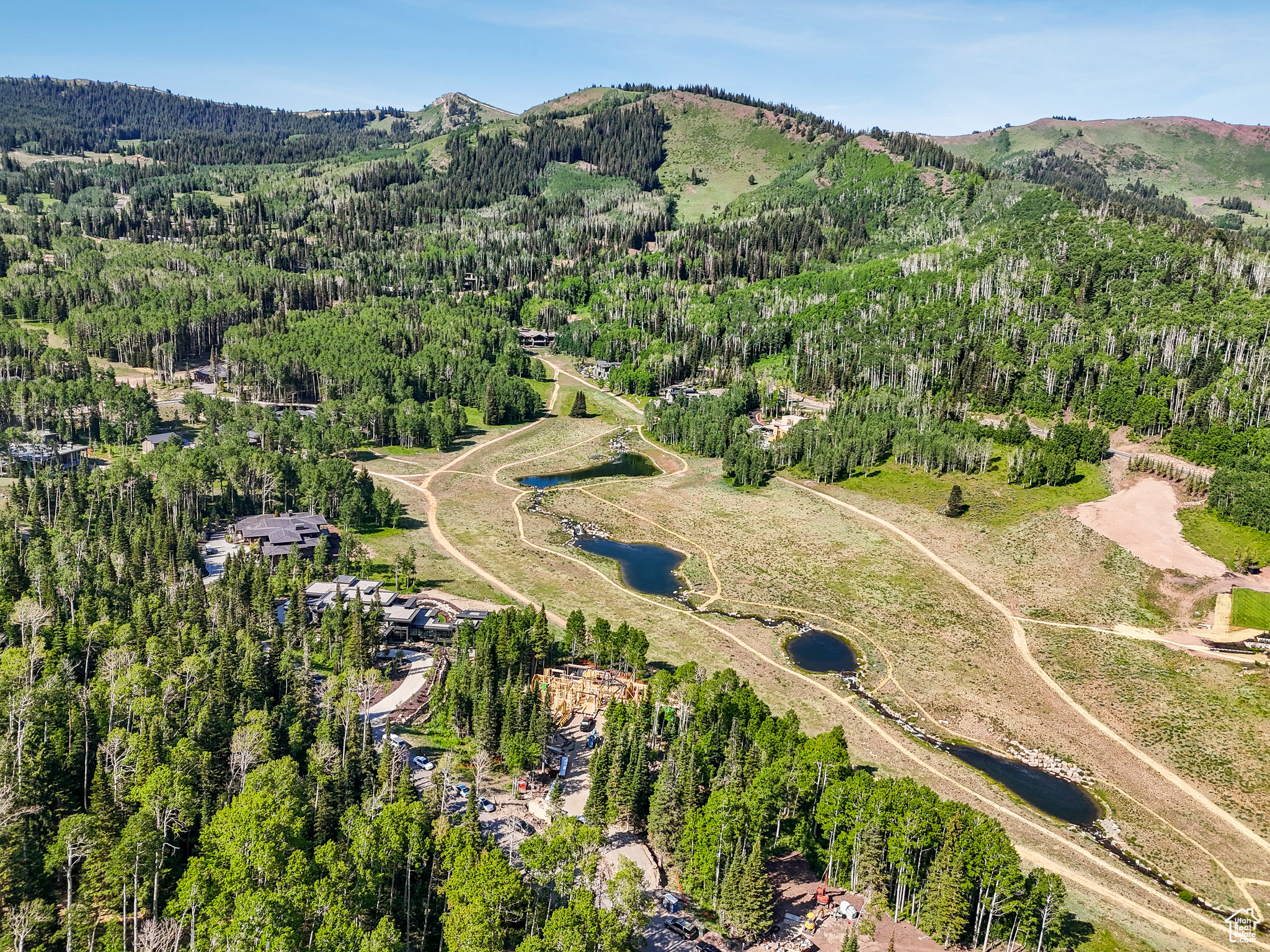This private custom ski-in/ski-out home is currently under construction and expected to be completed Fall of 2026. It's nestled within The Colony at White Pine Canyon, an exclusive guard-gated residential neighborhood consisting of large acreage lots with direct ski and snowboard access to the Nation's Largest Ski Resort. The legacy ski resort home of your dreams, this floor plan spans over 11,600 sq ft and promises the perfect mix of comfort and luxury with plenty of indoor and outdoor living areas for unparalleled enjoyment and ample space for hosting and entertaining family and friends. Surrounded by natural beauty, this residence is a haven amidst the trees, offering breathtaking views of the mountains and ski runs as well as the enchanting ponds, all visible from the comfort of your luxurious retreat.