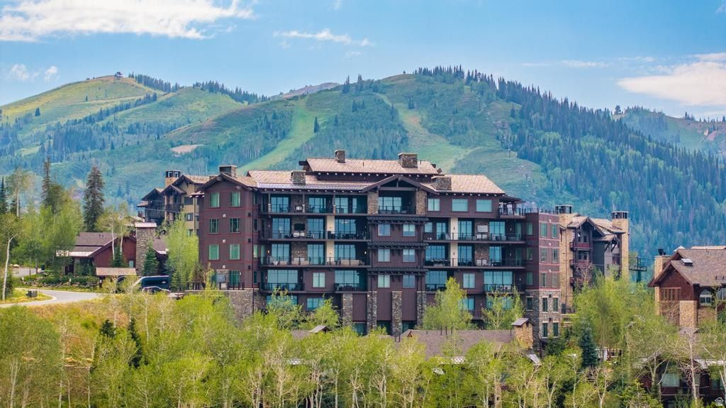 Perched atop The Residences at The Tower in the heart of Deer Valley's coveted Empire Pass, this extraordinary residence presents one of the rarest ownership opportunities in all of Deer Valley. Here, exceptional architecture, breathtaking natural beauty, and world-class service converge in a way that simply cannot be replicated. Walls of glass frame an awe-inspiring 180-degree panorama spanning the Uinta Mountains, the mountain valley below, and Deer Valley's iconic ski terrain. These ever-changing vistas become an integral part of the home's design, while expansive outdoor living spaces provide the perfect setting to experience every sunrise, snowfall, and season from an unrivaled vantage point. Originally constructed to an exceptional standard, Tower Residence 13 has been thoughtfully elevated through a collection of bespoke enhancements. Every curated designer detail - from the sophisticated lighting plan to the stunning floor-to-ceiling custom bar and impeccable custom finishes - reflects an extraordinary level of craftsmanship and intentional design rarely found in mountain residences. Just an elevator ride away, The Tower Club delivers Deer Valley's signature white-glove lifestyle with private ski valet, seamless ski-in/ski-out access, exceptional dining, owners' lounges, spa amenities, and attentive service that transforms every day on the mountain into an effortless experience. An available Talisker Club membership expands this exceptional lifestyle far beyond the slopes. Members enjoy exclusive access to four distinctive private club venues, and the renowned Tuhaye golf community overlooking the Jordanelle Reservoir. More than an exceptional residence, this is a legacy property where timeless architecture, panoramic views, impeccable craftsmanship, and one of Deer Valley's most prestigious addresses come together with an unmatched four-season lifestyle to create an extraordinary mountain retreat for generations to come.