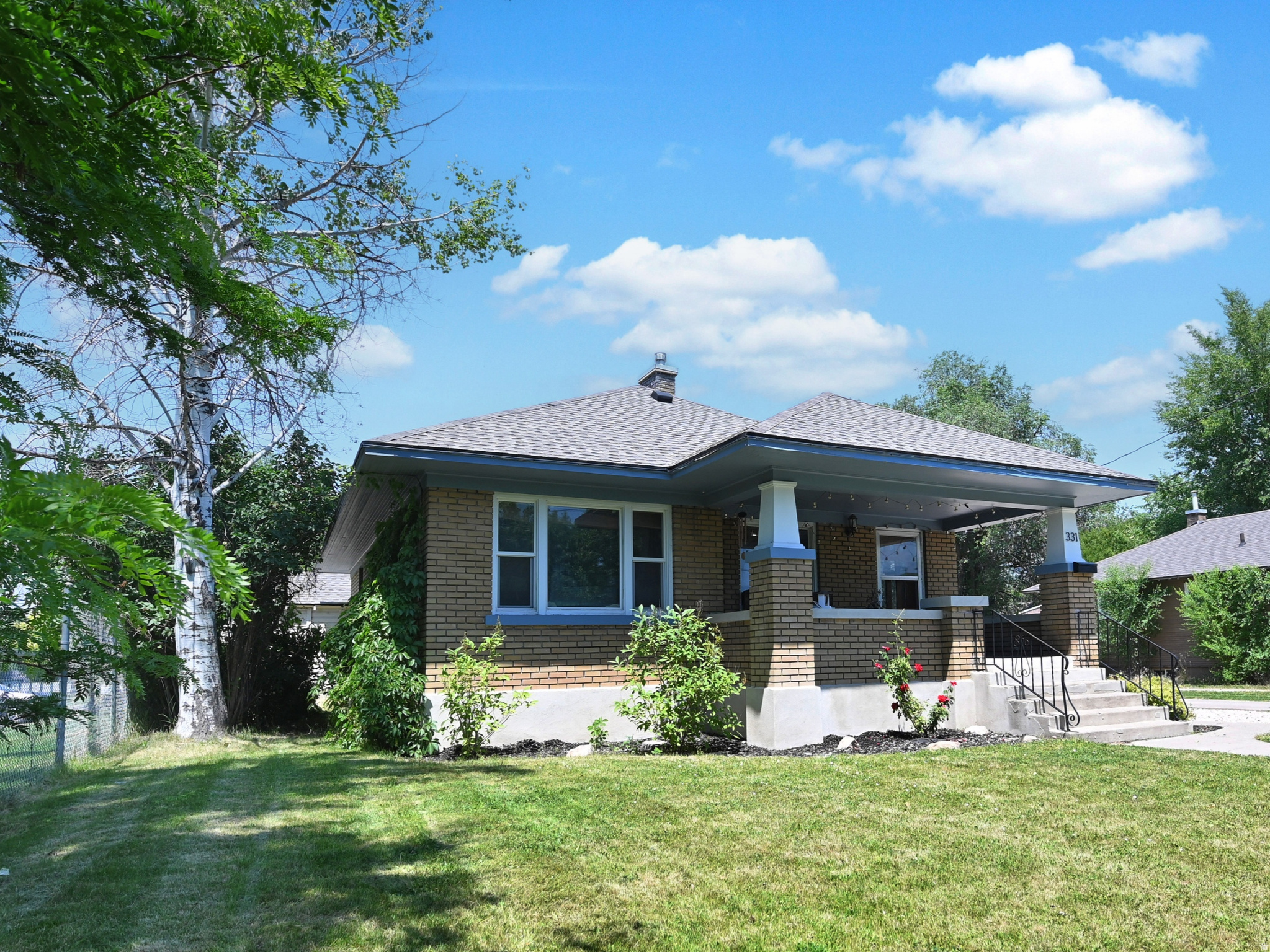 You MUST see this charming 1920 brick bungalow located at 331 W 300 N, Logan, Utah! Offering 3 bedrooms and 2 full baths, this home gives you 1,549 square feet of inviting living space on a generous .23-acre lot. Enjoy a functional layout with a comfortable living room featuring original built-ins that are period-appropriate, highly desirable, functional, and full of charm. French doors invite you into a flexible space that is perfect for a home office, reading room, playroom, or guest space. The eat-in kitchen is conveniently positioned for everyday living. The basement bedroom is currently being used as the primary owner's bedroom and features an ensuite full bath for added comfort and privacy. The inviting front porch showcases the character and charm of this classic brick bungalow with plenty of space to sit, unwind, and enjoy the neighborhood. Major updates include a completely redone roof in 2023, and the property also features the convenience of a two-car attached garage and workshop. Located in a very walkable downtown setting, this property offers easy access to local dining, shopping, parks, schools, and community amenities. A wonderful opportunity to own a historic Logan home with flexible living areas, thoughtful details, a spacious lot, and a location that makes daily life simple and connected. Make sure to view the Matterport Viritual tour! Buyer to verify all.