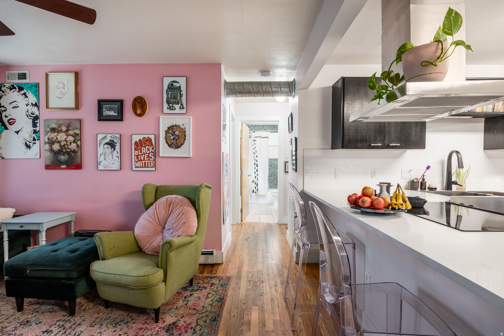 This cute and eclectic two-bedroom Marmalade condo moves well, and we think it's the perfect spot to land for anyone seeking something on the smaller side. An open layout connects the living room to a modern and updated kitchen that includes a sizable peninsula that earns its keep for both cooking and conversation (there's also plenty of storage and a washer/dryer in here to make daily life considerably easier). The primary suite has ample closet space, and the bathroom has been renovated with a terrazzo aesthetic in the shower, a vessel sink, and matte black hardware. The outdoor space here is communal, which means you get all the charm without the upkeep, and this location is its own quiet victory: historic, walkable, just north of downtown, and a few fantastic coffee shops and places to eat. Plus, residents get one designated parking spot, so you won't be circling the block after work. This is the kind of place that has personality...and you've still yet to unpack.