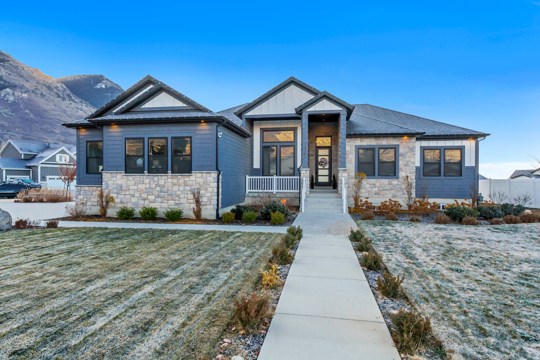 HUNDRED THOUSAND DOLLAR PRICE REDUCTION! Built to be a model home, this beautifully designed home featuring 6 bedrooms and 3.5 bathrooms with extensive upgrades and high-end finishes throughout. The great area hoists a beautiful, coffered 14 foot tall ceiling. The open, light-filled floor plan is ideal for both daily living and entertaining. A fully finished basement with 9 foot ceilings provides additional living space, perfect for guests, a home office, or recreation.  Enjoy outdoor living in the professionally finished yard and take in the spectacular mountain views that enhance the setting. An 3rd car oversized garage offers ample room for vehicles and storage and is temperate controlled with a mini split. Meticulously maintained and truly move-in ready, this home combines modern design, functionality, and quality craftsmanship throughout.    Square footage figures are provided as a courtesy estimate only and were obtained from an appraisal. Buyer is advised to obtain an independent measurement. Owner Agent.