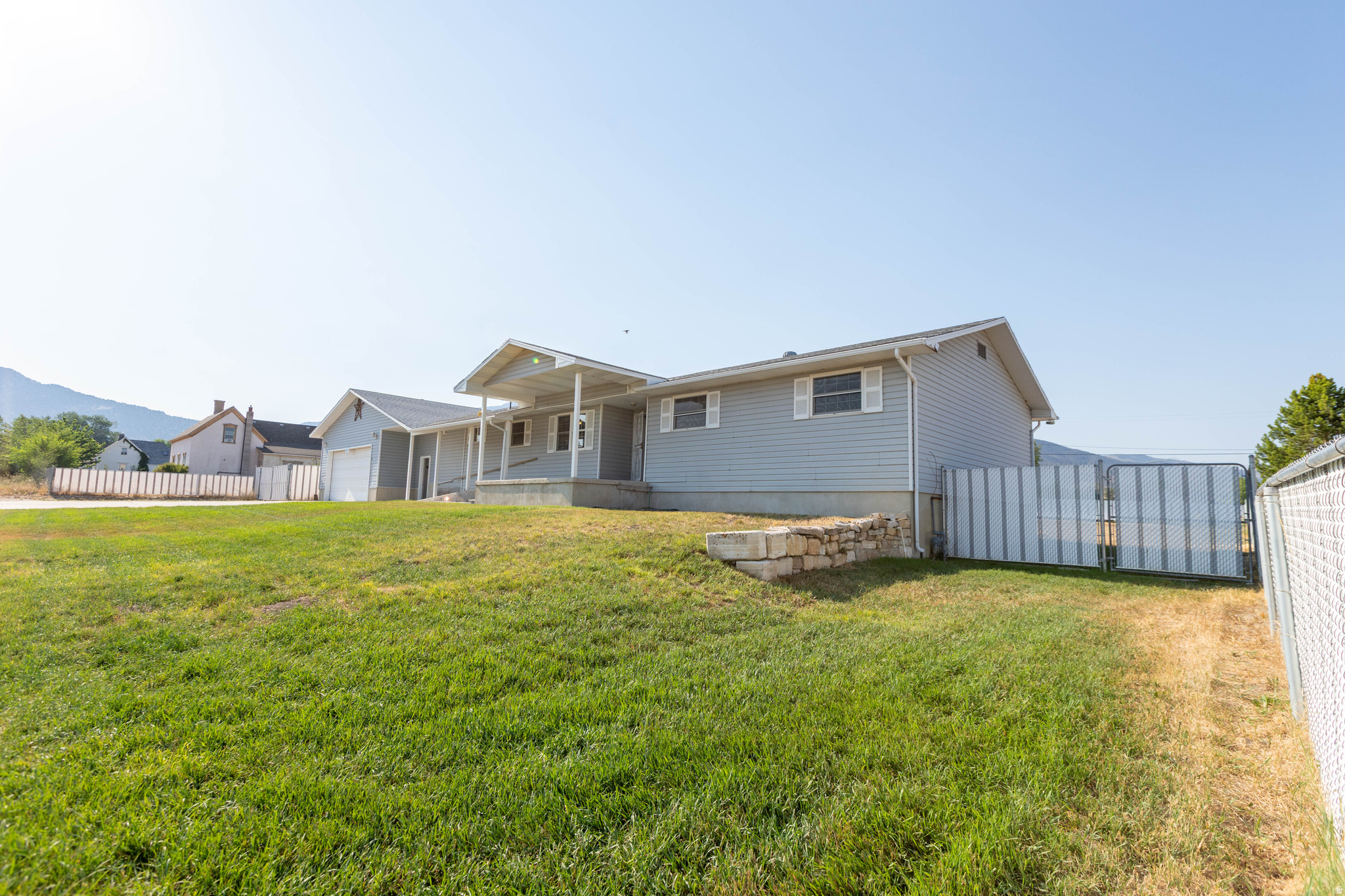 Welcome to this spacious rambler located in Manti, Utah.  This home has endless possibilities with it's large lot and plenty of room to grow, work, and play. Inside, the home offers comfortable living areas and a functional layout with 3 beds, 2 full baths, and one 1/2 bath. It also features a separate 2-bedroom, 1-bath basement apartment with it's own private laundry and entrance. Outside, you'll find multiple outbuildings, ample parking, and room for animals, gardening, hobbies, equipment, or future improvements. There is so much storage space with this home. Whether you're looking for an investment property, a home with supplemental income, or a place with room to spread out, this property delivers flexibility, value, and small-town charm. Don't miss this unique opportunity to own a property with income potential, abundant storage, and room to make it your own in beautiful Manti.