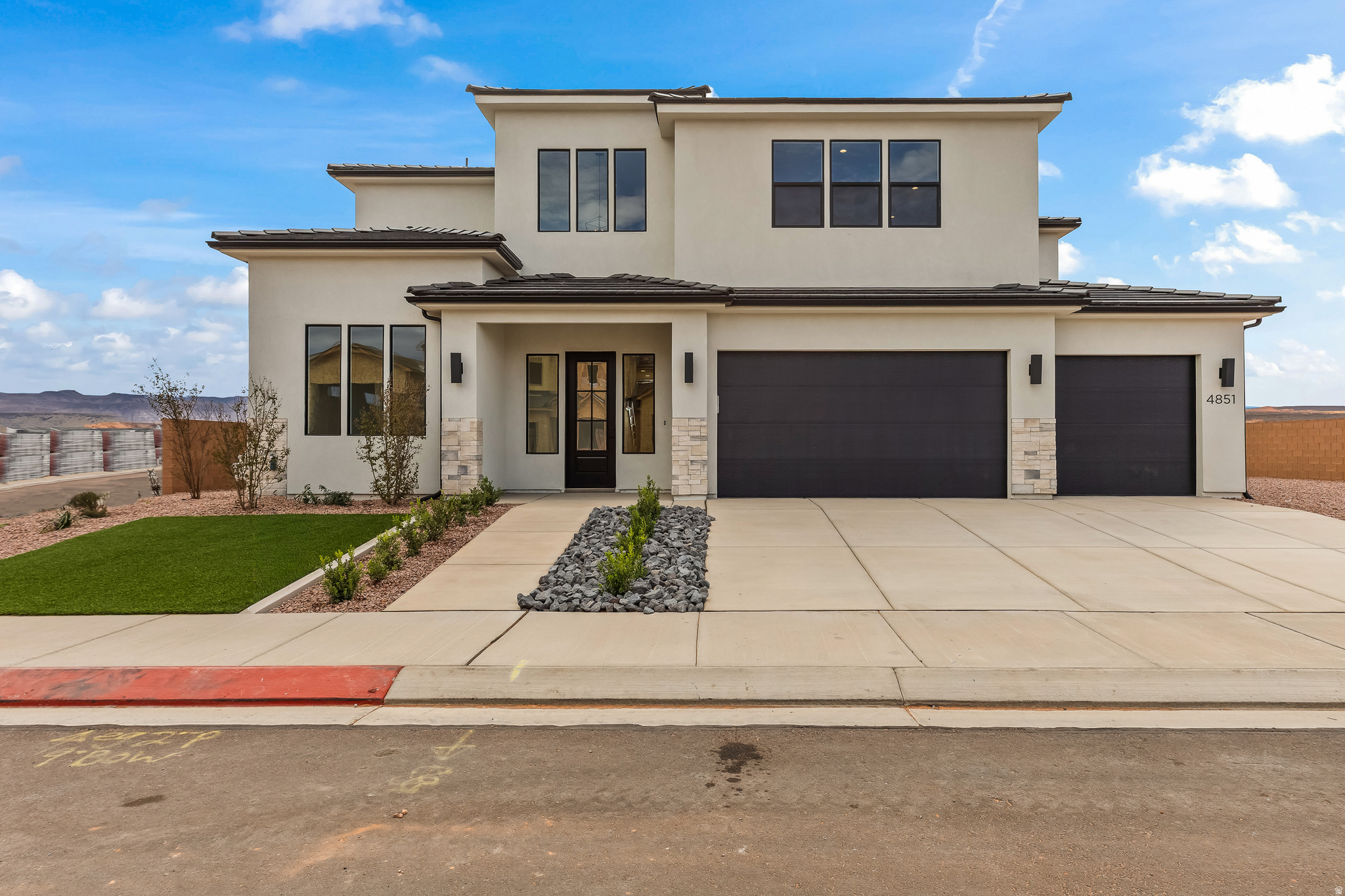 PRICE IMPROVEMENT! Welcome to the Summitglow, an impressive 3,634 sq ft home designed to elevate everyday living. Featuring 6 bedrooms, 3.5 bathrooms, and 3-car garage, this home offers room to grow with refined style throughout. Enjoy soaring 10' ceilings on the main level and 9' ceilings upstairs, complemented by 8' tall doors that enhance the home's grand, open feel. A front office provides the perfect workspace, while the oversized upstairs loft offers endless flexibility for a media room, play space, or second living area. The heart of the home shines with elevated finishes, including generous kitchen cabinetry, a tiled backsplash, 3cm quartz countertops, a built-in hood, and upgraded appliances-fridge included.  The spa-like primary suite is a true retreat, highlighted by a stunning freestanding tub and upscale finishes. Additional upgrades include a modern black railing, built-in mudroom bench, laundry room cabinetry, upgraded carpet and pad, and a large covered back patio ideal for outdoor entertaining. Thoughtfully designed and beautifully finished, the Summitglow delivers luxury, comfort, and functionality in one exceptional home. All information is deemed reliable but not guaranteed, buyer to verify all. The home is not located in a PID which means large property tax savings!