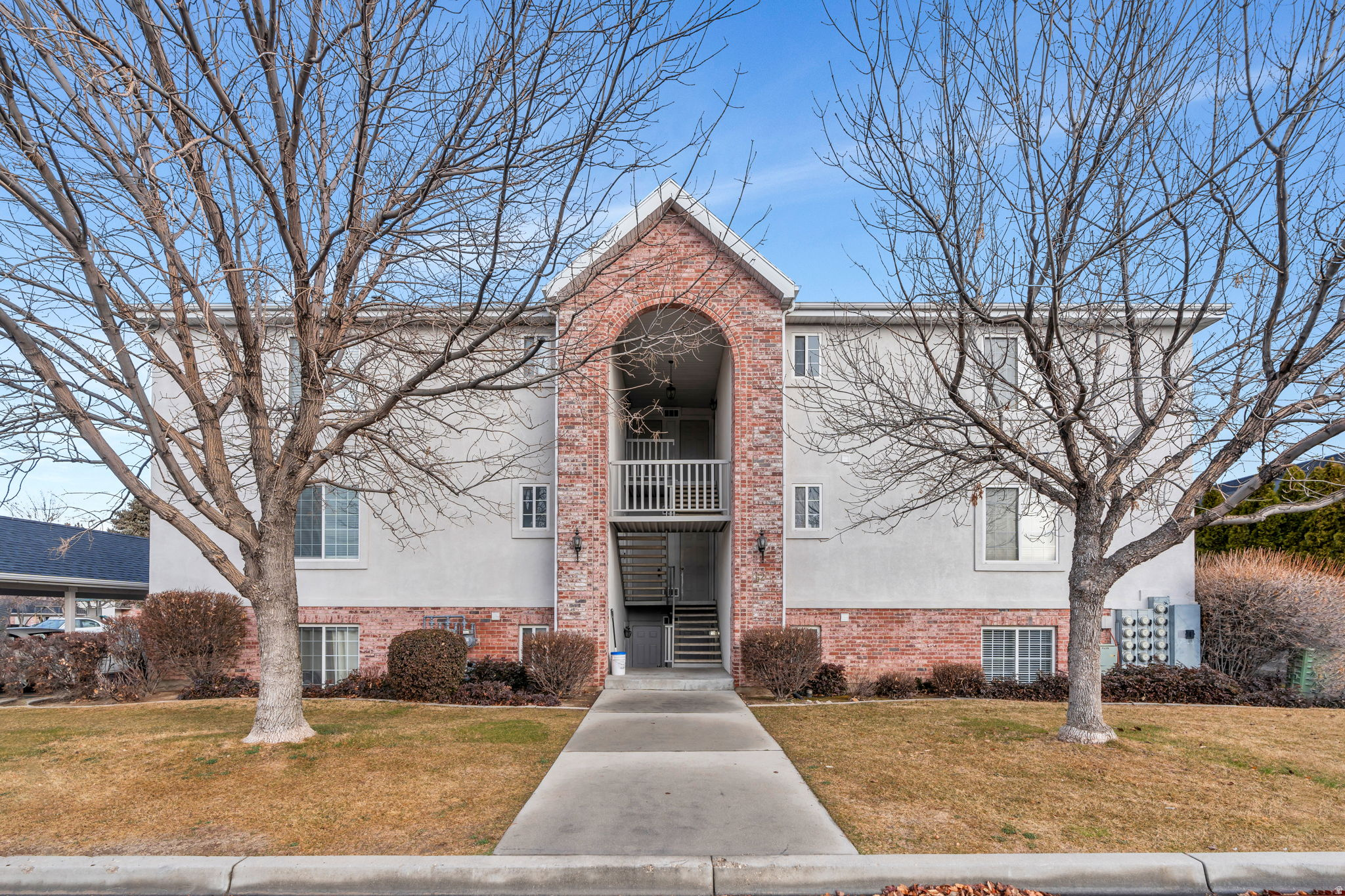 Incredible Location!  This amazing 2-bed, 2-bath condo is centrally located to everything in Orem, including UVU, shopping, and I-15. The primary bedroom has a large walk-in closet and an ensuite bathroom. Recently remodeled kitchen and baths, with white cabinetry, stainless steel appliances, and wood laminate flooring. There is also an enclosed storage shed for extra space and a covered parking spot. It has great amenities, including a fun park/playground for children and snow removal by the HOA. Brand new paint throughout. The unit is vacant and easy to show.