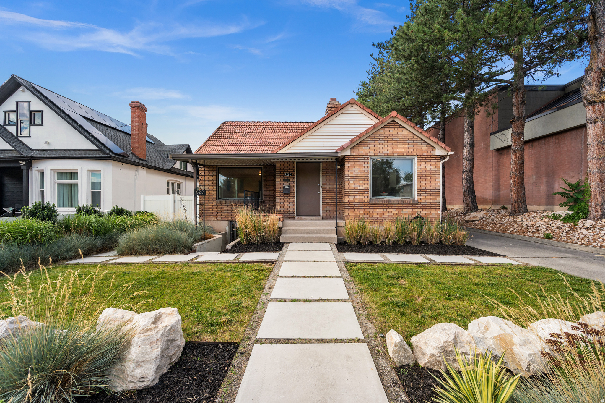 This versatile 3 bed/2 bath home beautifully combines 1930's brick cottage charm with major modern upgrades. The flexible layout features a 2BR/1BA main level and a separate-entrance 1BR/1BA lower level. Currently configured as a mother-in-law apartment, but could be converted back to single-family use. Updates include new AC, tankless water heater, water softener and a down to the studs full bathroom remodel. Outside, the landscaping was professionally designed and installed in 2021 with a smart sprinkler and drip irrigation system. Rare 4-car tandem garage complete with roof replacement and automatic garage doors installed in 2018 has lots of possibilities, from storing extra vehicles, a home-gym, a workshop, or space for all your hobbies. Fully-fenced yard for your own private retreat. Steps away from the remodeled Macey's Sugarhouse Market. Amazing central location between Liberty and Sugarhouse parks, and walking distance to local dining and coffee shops.