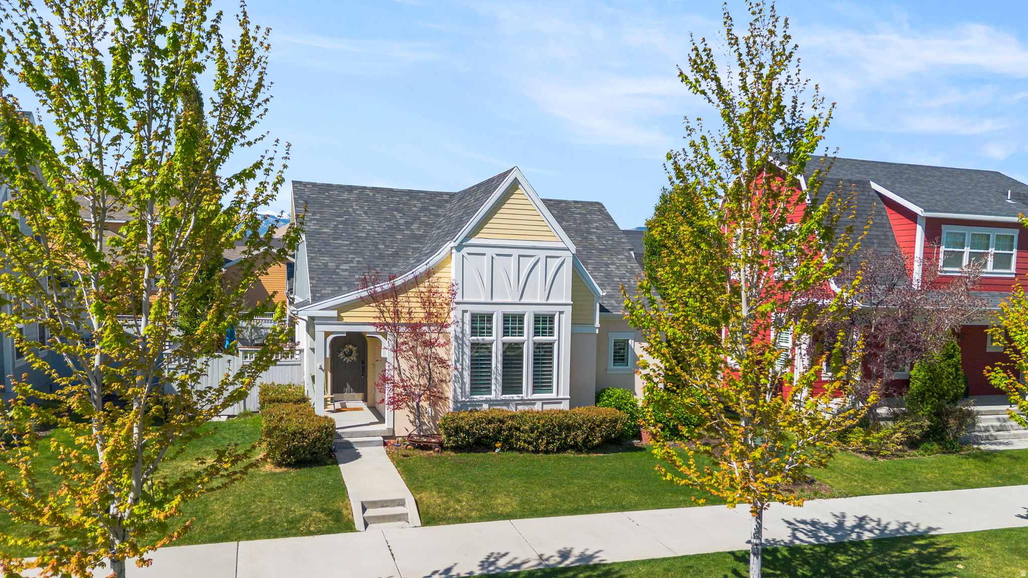 Perfectly positioned in one of Daybreak's most desirable neighborhoods, this charming and thoughtfully designed rambler offers bright, open living spaces and the ease of main floor living. Vaulted ceilings and abundant natural light create an airy feel throughout the home, where the living room flows seamlessly into the dining area and central kitchen. Designed for both everyday living and entertaining, the kitchen features quartz countertops, a large island, stainless steel appliances, and a gas range, while plantation shutters throughout the main level add warmth and timeless style. The spacious primary suite offers a relaxing retreat with vaulted ceilings, a walk-in closet, and an ensuite bath complete with dual vanities, a separate soaker tub, and euro-glass walk-in shower. Two additional bedrooms and main floor laundry provide added flexibility and convenience. The fully finished basement expands the home with an expansive rec room ideal for gatherings, movie nights, or game days, along with three additional bedrooms, a full bathroom, and generous storage including a large cold storage room. Outside, the beautifully landscaped backyard and covered porch create a peaceful setting for outdoor dining and relaxing. Located just minutes from highly rated schools, community parks, Oquirrh Lake, Harmons, and the new restaurants and shops at North Shore, this home offers an exceptional Daybreak lifestyle.