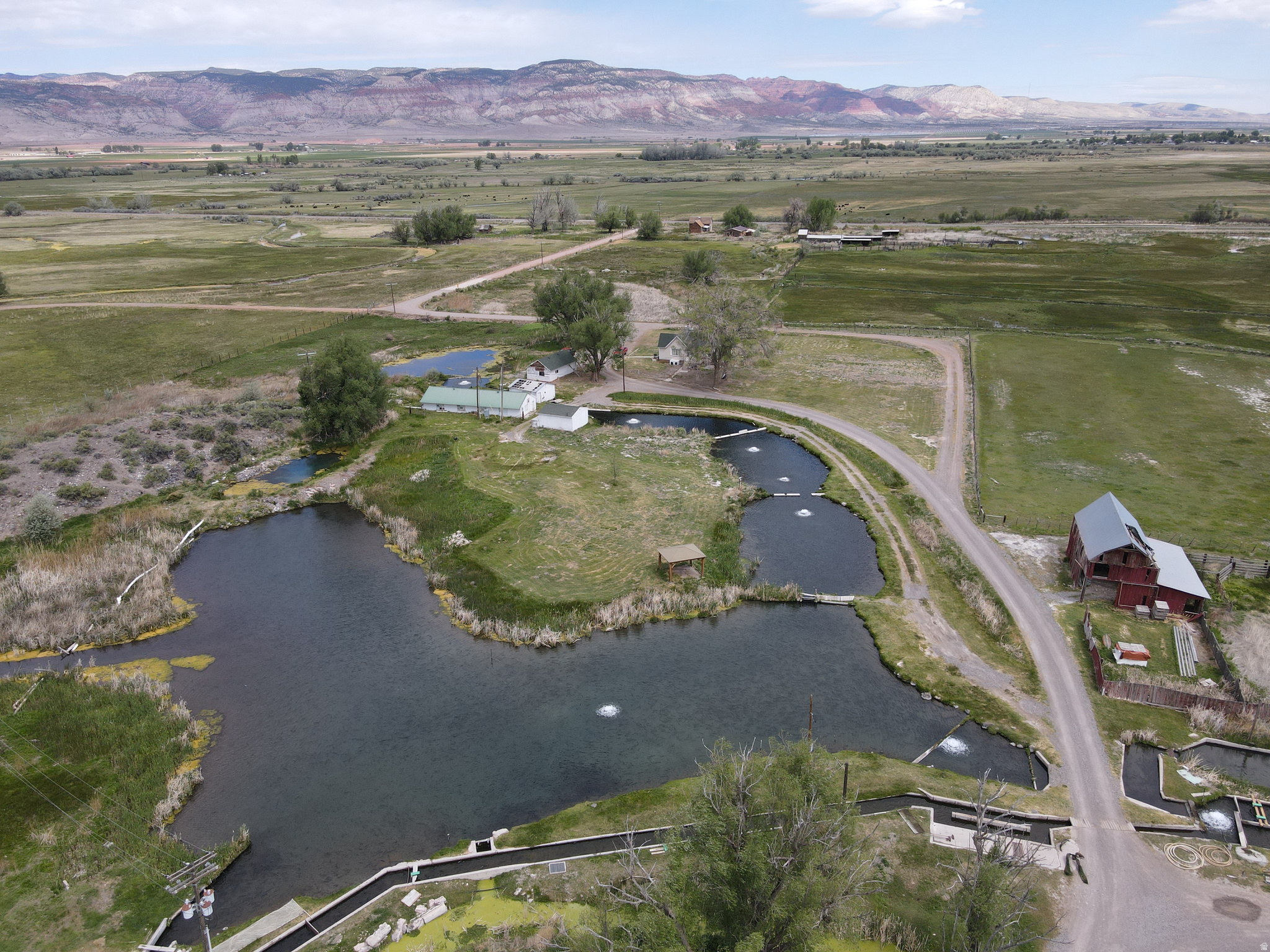 Nestled at the headwaters of the Cove River in the heart of Central Utah, the Cove River Ranch is a rare and storied property with over a century of productive history. Spanning 24.7 acres just 4 miles east of Richfield, this working fish hatchery operation offers an exceptional combination of established income potential, pristine natural resources, and unmatched lifestyle amenities. Whether you're an aquaculture operator looking to expand an existing business, an entrepreneur ready   Square footage and acreage figures are provided as a courtesy estimate only and were obtained from the county .  Buyer is advised to obtain an independent measurement.