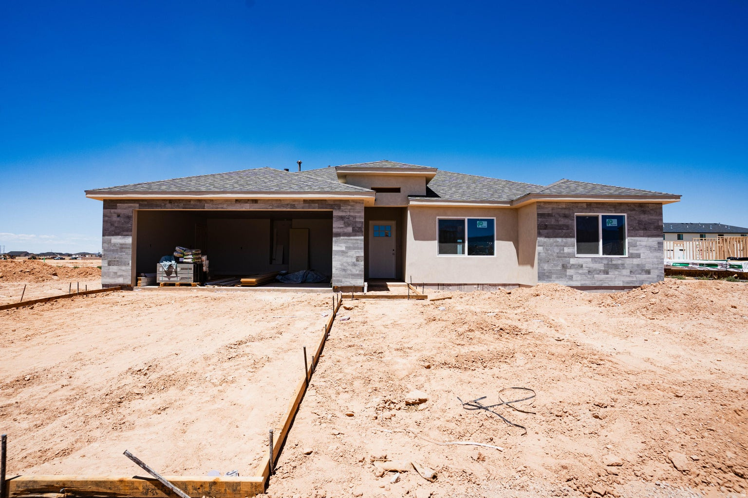 This beautifully crafted 3 bed, 2 bath home by Holyoak Homes, located in Cedar City's desirable Iron West Subdivision. Sitting on a spacious 0.21-acre lot, this new construction features premium finishes, an open-concept layout, and a stylish kitchen perfect for entertaining. Contact the listing agent today to ask about available incentives!