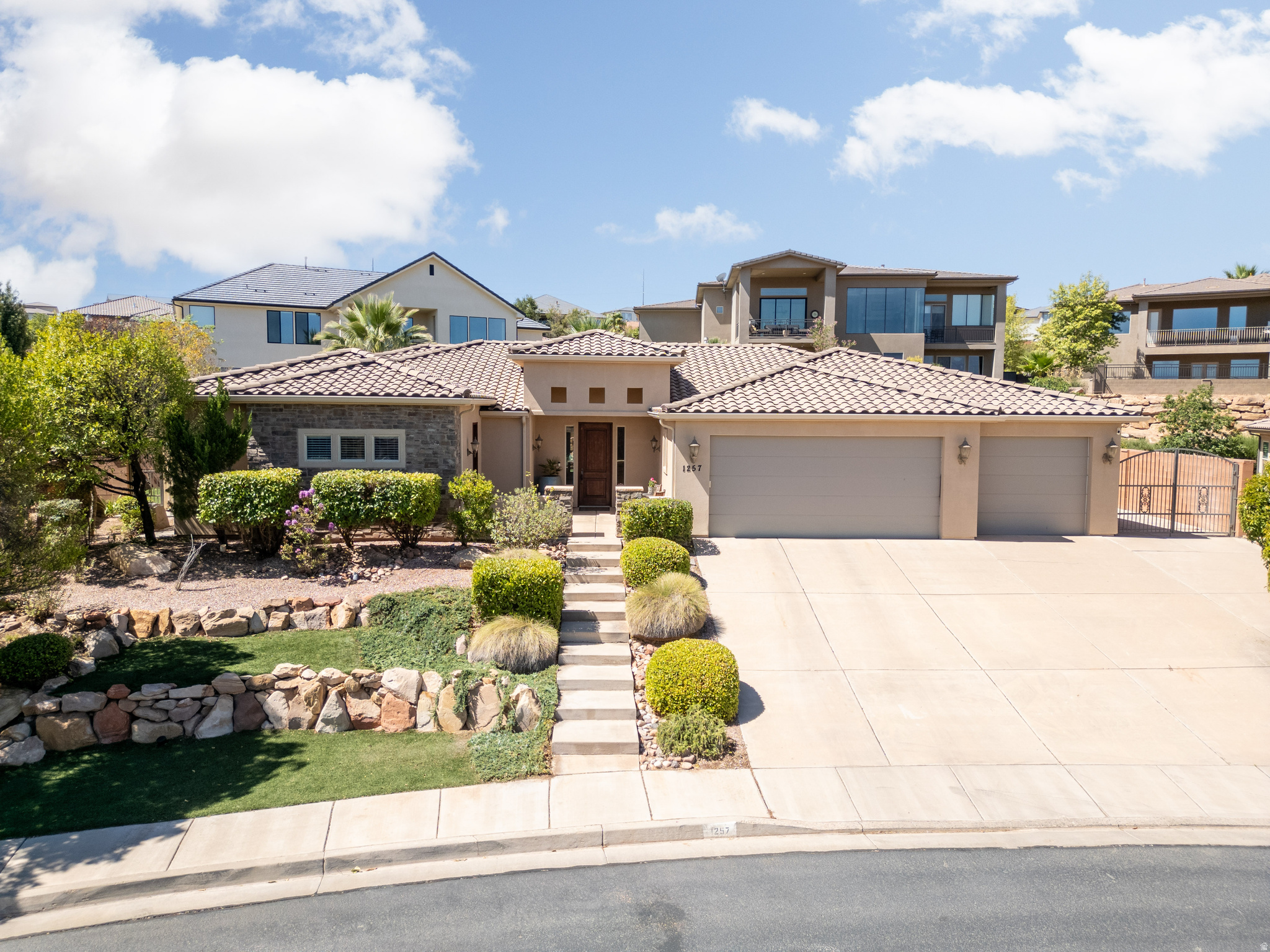 Tonaquint Terrace Charmer! Welcome to this beautifully maintained home in the highly desirable Tonaquint Terrace community. Offering four spacious bedrooms plus a dedicated office, this residence provides flexible living for work, play, and relaxation. The inviting main gathering area is perfect for hosting and everyday living. The kitchen features rich wood cabinetry, stainless steel appliances, and an open layout ideal for cooking and entertaining. Storage is abundant throughout the home with large closets and thoughtfully designed spaces. Step outside to enjoy a beautifully landscaped yard with a covered patio-perfect for outdoor entertaining, play, and quiet evenings and a dip in the swim spa! Located in the heart of St. George (84790), this home blends comfort, style, and practicality in one of the area's most sought after neighborhoods. Don't miss your chance to make this Tonaquint Terrace gem yours.