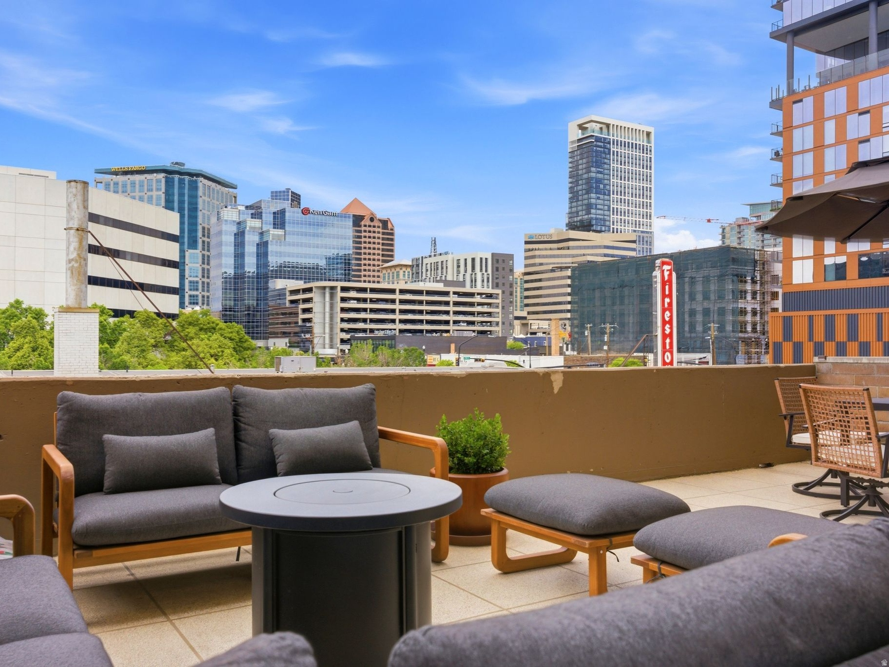 Easily the best condo in Salt Lake at this price point! Nowhere else can you get a nearly 400 sq. ft. patio and million-dollar views of downtown without the million-dollar price tag. This is one of only four units in the building, aside from the penthouse, with an oversized west-facing patio. The condo features floor-to-ceiling sliding glass doors, polished concrete floors throughout, central air, in-unit washer and dryer, and a reserved parking space in a secured garage. Or...ditch the car altogether! You can walk to everything! Coffee shops, Harmons Grocery, City Creek Mall, the Delta Center, and countless restaurants are all just steps away. If you're looking to get outdoors, Memory Grove Park and the trailhead to City Creek Canyon are less than a mile away.  Square footage figures are provided as a courtesy estimate only. Buyer is advised to obtain an independent measurement.