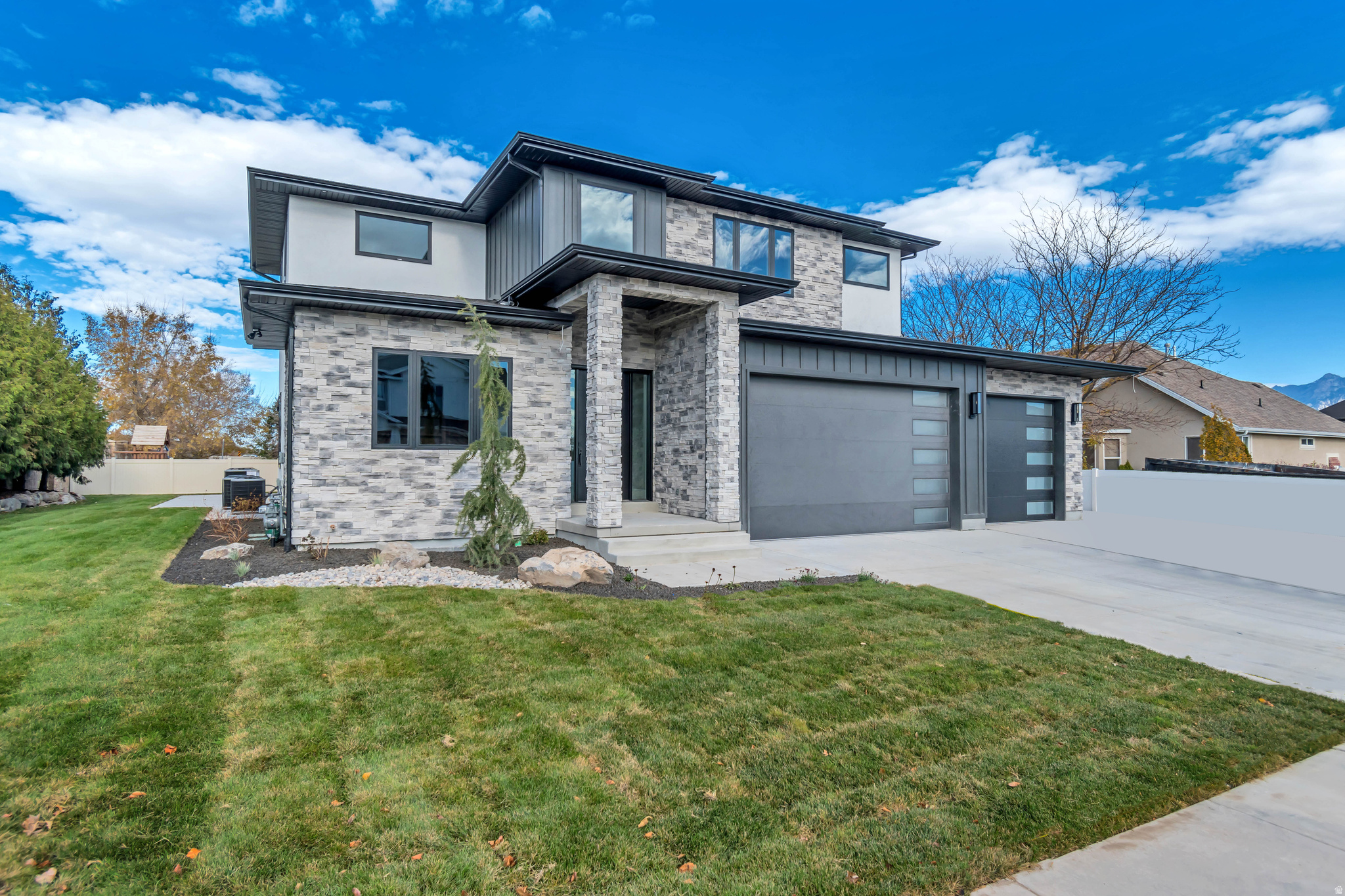 Welcome to South Jordan's Premier New Construction Luxury Estate-- Introducing a masterpiece of modern custom craftsmanship in a beautiful South Jordan neighborhood.  Built in 2025, this extraordinary 7,611 sq. ft. residence was designed for the way families truly live - with the space, flexibility, and elevated finishes that make every day feel exceptional. Spanning three thoughtfully designed levels, this 8-bedroom, 6-bathroom home delivers an unmatched combination of grand entertaining spaces and intimate retreats. The main floor impresses with soaring ceilings, a formal living room, a spacious family room, semi-formal dining, and a chef's kitchen - all flowing effortlessly for both everyday living and large-scale entertaining. An executive den and main-floor primary suite add to the home's functional elegance. The primary suite is a true sanctuary, complete with a separate soaking tub and shower, and finishes that rival the finest luxury resorts including private laundry facilities. The upper level offers 2,720 sq. ft. of private living, featuring generously sized bedrooms with thoughtful layouts designed for growing families, and a flexible media room. Downstairs, the 2,159 sq. ft. finished basement expands the possibilities - a second family room, an additional kitchen and dining area, dual laundry rooms, and flexible bedroom spaces make this level ideal for multigenerational living, guest accommodations, a rentable space, or a private in-law suite.  This property delivers on every front: location, quality, and lifestyle.