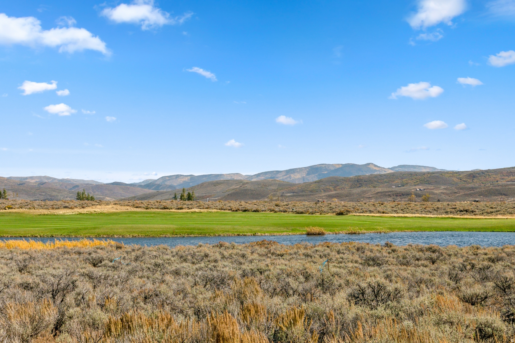 Scenic Valley lives up to its name, offering a peaceful retreat defined by panoramic views and natural beauty. Overlooking the dramatic Uinta Mountain Range, this neighborhood features thoughtfully positioned homesites ideal for building your custom mountain residence. Select homesites enjoy golf frontage along the Jack Nicklaus course, creating a setting that feels both private and connected to the surrounding landscape. Tucked near the Painted Valley gate for easy access, Scenic Valley also places residents within walking distance of the Double Deer Clubhouse--perfect for an evening dinner, a day at the spa, or a quick stop at the pro shop. Just minutes from the Promontory Beach Club and surrounded by scenic trail systems, the neighborhood offers a balance of relaxation and recreation. With Deer Valley's East Village lifts less than a 15-minute drive away, Scenic Valley is an ideal home base for year-round mountain living.