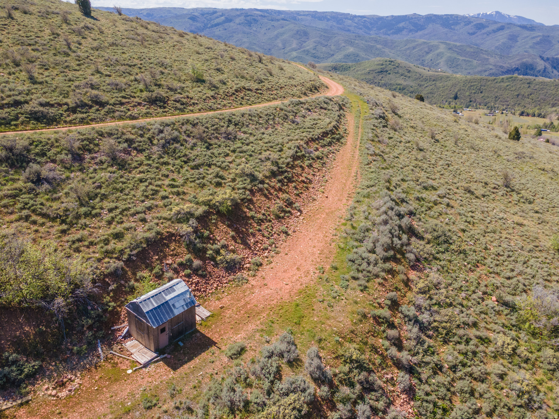 Escape to your own mountain retreat just a short drive from Causey Reservoir, Monte Cristo, and the scenic Ogden Valley. This elevated 2.26-acre lot is a true getaway, offering sweeping mountain views, miles of nearby trails, and a ready-to-use shed for outdoor fun. Perfect for a family campsite retreat or a place to store gear and toys, this property invites you to unplug, explore, and create unforgettable summers.  Key features: - Size and setting: 2.26 acres of elevated terrain with spectacular mountain views - RV and camping ready: room for 2 large RV pads, ideal for toy haulers and family camping - Driveway in place: easy access onto the lot and parking for multiple vehicles - Storage and outbuilding for equipment and gear - Location, location, location: close to Causey Reservoir, Monte Cristo, and the greater Ogden Valley for endless outdoor adventures - Proximity to water recreation: just 20 minutes to Causey Reservoir and 25 minutes to Pineview Reservoir - Build-ready potential: if you decide to build a cabin or home, you would need a water source and septic in place (not currently in place)  What makes this property special: - An elevated site that feels private yet is easily reachable for weekend getaways - Wide-open space to spread out, camp, and enjoy the fresh mountain air - Walk the property to fully appreciate the views and terrain  Important notes: - Sign on the property for easy identification - There is no cell service in the area; plan accordingly for communications - Water and septic are not currently in place if you plan to build  Bring your toy haulers, your hiking boots, and your sense of adventure. This is the perfect spot to make summer memories and use as a family campsite retreat. Feel free to walk the property and envision your own mountain sanctuary.  Call today to schedule a walkthrough or to get more details. This elevated recreational lot won't last long!    3379 N Oak Canyon Rd / Lot next door is also for sale by same owner.
