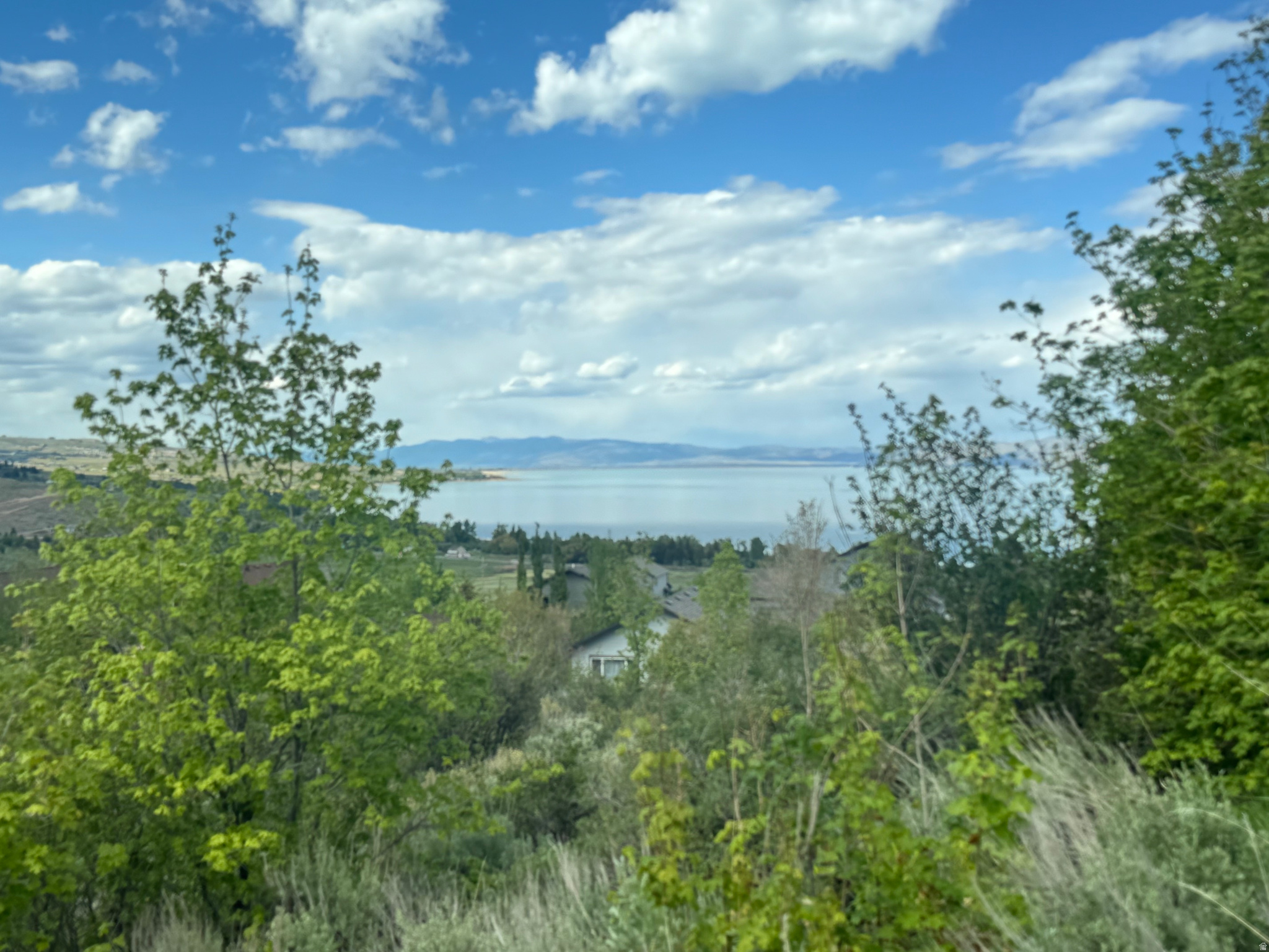 Excellent building lot in Swan Creek Village!  Lake views and has some trees on it.  Year round access. Close to Garden City (shops, dining) and Bear Lake State Park Marina (boat launching) - 2 minutes.  The Sinks/Cache National Forest for ATV/UTV and snowmobiling trail system - 10 minutes.  Beaver Mountain Ski Resort - 20 minutes. Short term rentals are not allowed by HOA.