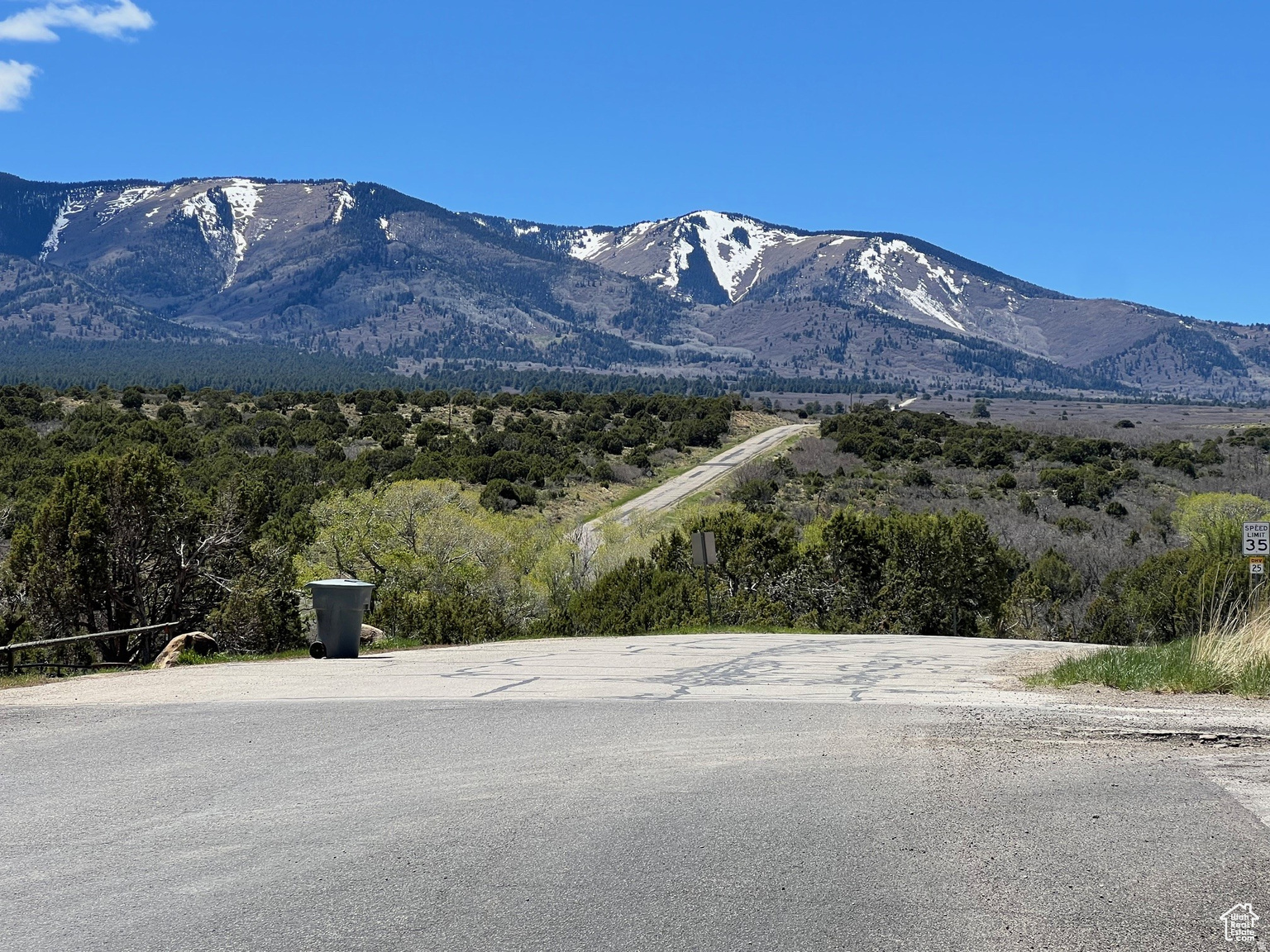 Build your dream home on this .35 acre lot close to everything Monticello has to offer...  schools, hospital, mountains, etc.  are all within walking distance.  Lots on this side of town are desirable with convenient location and access (paved road with a driveway entering from Abajo Drive...(Monticello city utilities)!  Existing frontage fence will be taken down.  Mountain views are amazing...really nice blend of small-town charm and country living but with the modern conveniences of city limits.