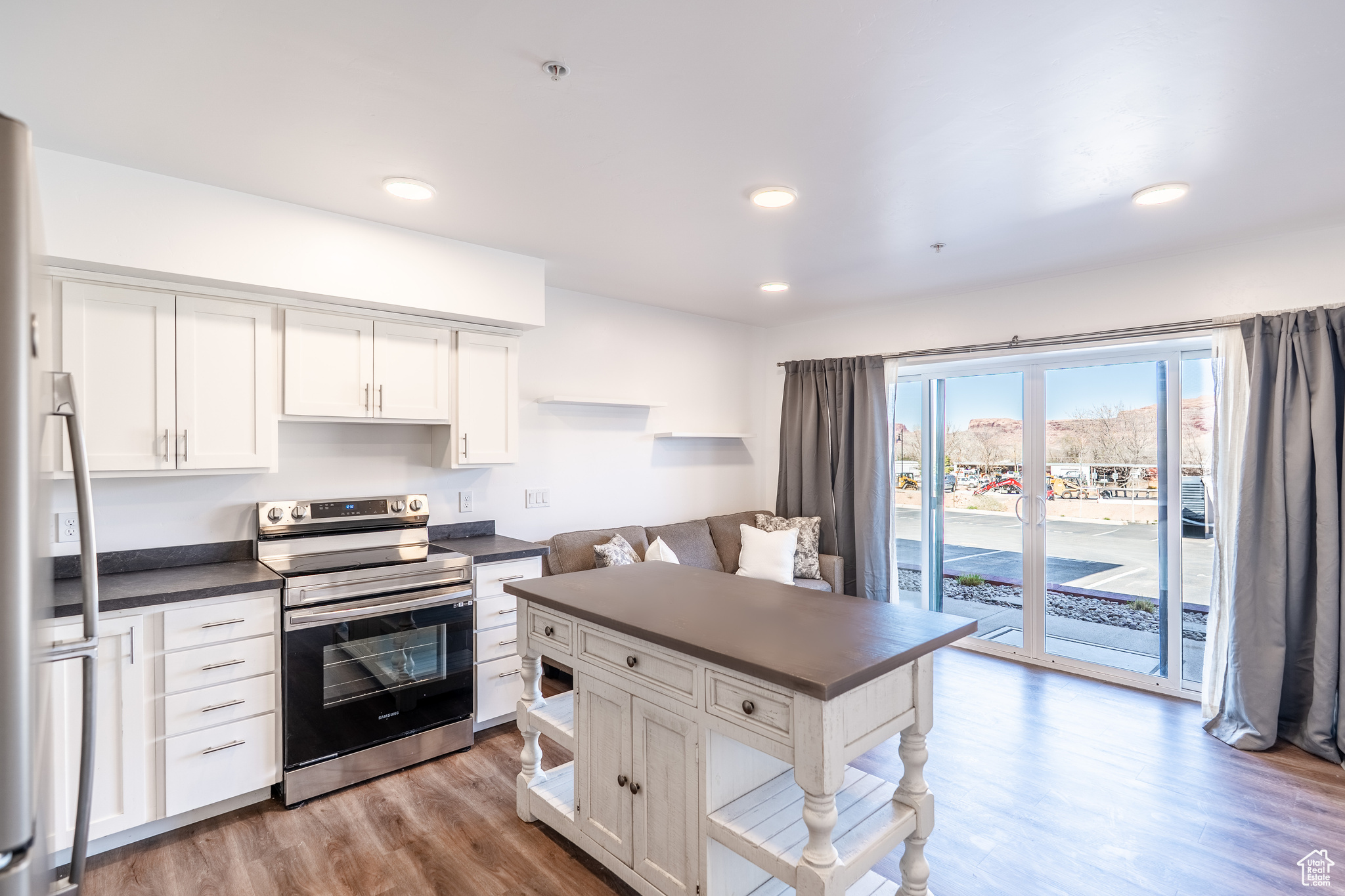 FURNITURE INCLUDED! This studio, nestled at the base of the Moab Rim, offers easy access to downtown Moab and its legendary outdoor activities. Uniquely, this unit potentially allows for monthly rentals, providing flexible income potential without requiring owner occupancy. Enjoy modern comforts including wood-grain vinyl flooring, in-unit laundry, a covered patio, and dedicated parking, plus extra spots for guests as well as bike racks.