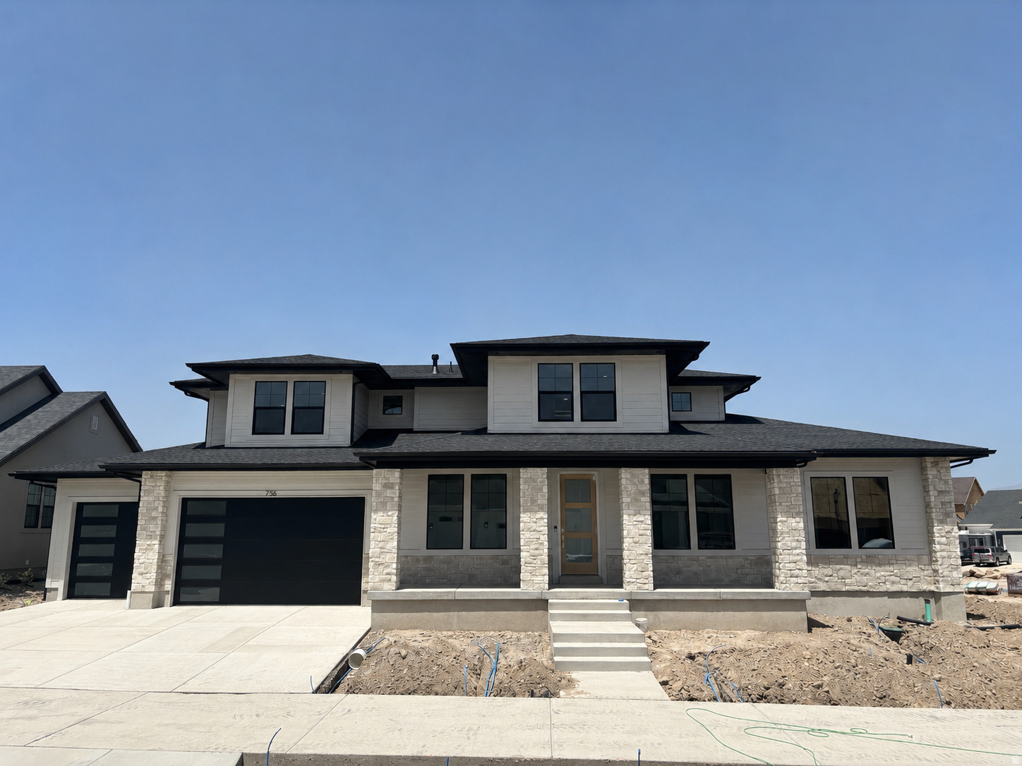 LOT#166 in Beacon Pointe by Symphony Homes. This stunning 'Browning XL' plan blends luxury with thoughtful design. Home is under construction and will be completed in July. Price includes full yard landscaping. Lots of upgrades and designer finishes throughout! The main floor features both a flex room (w/ French doors) and a formal living room with custom millwork and both have crown molding. Grand great room with two-story ceiling with wood beam grid ceiling. The gourmet kitchen will have quality appliances including a 48" ZLine 8-burner dual fuel range with double ovens, and a built-in refrigerator and freezer, a spacious butler's pantry, and a bright dining nook that opens to the covered patio. A custom mudroom bench and a large laundry room add everyday convenience. The expansive primary suite will have a decorative ceiling and includes a large custom-finished wardrobe room with a window. Primary bathroom will be a show-stopper with separated vanities plus a makeup counter, free-standing soaker tub, and 78x60 walk-in shower with a quartz bench. Upstairs has a loft open to below and a large bonus room. All bedrooms feature walk-in closets. The fully finished basement is built for entertaining with a media room, kitchenette, huge game room, and a gym with 3/4 bathroom (also accessed by adjacent bedroom). Garage will be finished to paint and 3rd stall is 38' deep and 18' wide in the back for potential to park capacity of 4 vehicles.  9' foundation walls, an active radon system, and a cold cellar. A must-see!