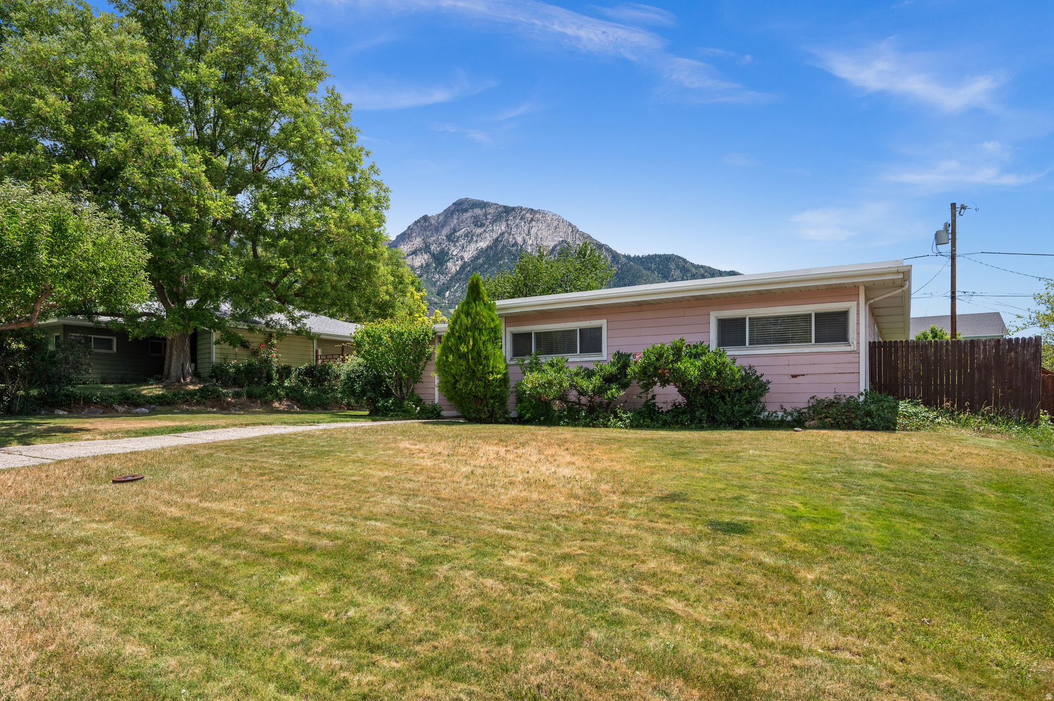 Welcome home to this charming, move-in-ready gem nestled in one of Utah's most sought-after communities-Millcreek. Offering the ease and convenience of main-floor living, this beautifully updated home combines timeless character with modern improvements, making it an exceptional opportunity for first-time buyers, downsizers, or anyone looking for a turnkey home in an unbeatable location. Inside, you will find 2 comfortable bedrooms, 1 beautifully updated bathroom, a spacious family room perfect for gathering with family and friends, a dedicated laundry room, and an inviting kitchen featuring thoughtful updates and a cozy dining nook for everyday meals. Situated on a generous 0.18-acre lot, the backyard provides plenty of room to relax, entertain, garden, or simply enjoy Utah's beautiful seasons. Major updates-including the electrical, plumbing, windows, kitchen, and bathroom-provide peace of mind, allowing you to move in and immediately enjoy your new home. Millcreek is known for its tree-lined streets, established neighborhoods, convenient access to shopping, dining, parks, hiking and biking trails, world-class ski resorts, and downtown Salt Lake City. It is easy to see why this continues to be one of Utah's most desirable places to call home. If you have been searching for a home that offers charm, thoughtful updates, and an incredible location beneath Mount Olympus, this is one you won't want to miss. Schedule your private showing today and discover everything this wonderful home has to offer.