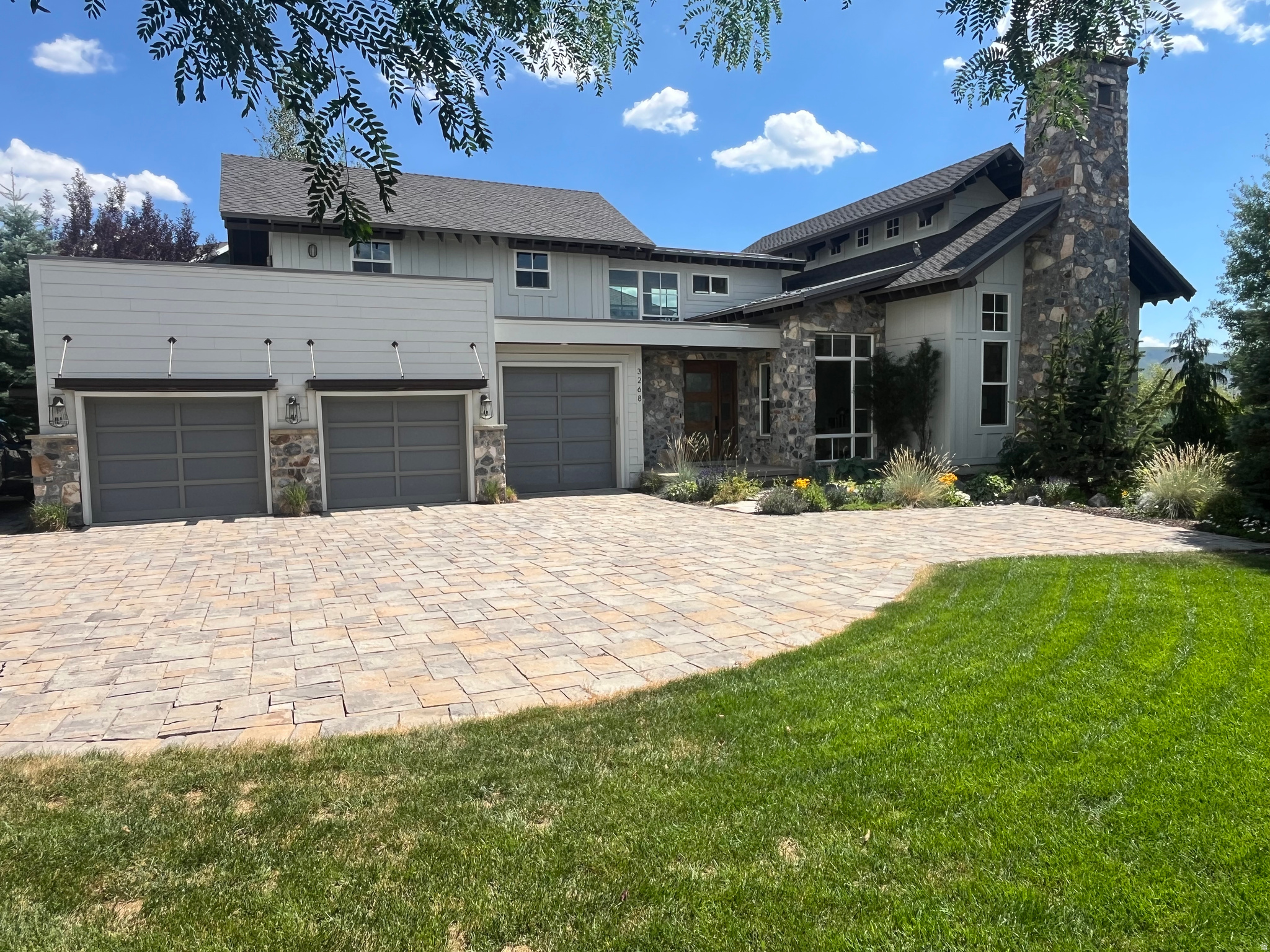 If you are looking for a truly unique and custom home this is it!  Features such as a vaulted clerestory ceiling in the main living area, rooftop patio gardens with an outdoor dining patio, Lake Creek running in your back yard, two outdoor firepit areas and a private office/studio accessed via the rooftop gardens only begin to describe the unique features.  The house was designed with an emphasis on the amazing Mount Timpanogos views from every room in the home.   The primary suite is more than just a bedroom, it has a private sitting room and also its own outdoor viewing patio.   Other rooms include a craft/laundry room, excercise room, bonus rec room above the garage and even an attached garden shed.  The professional landscaping outside of the home features multiple view patios, a  water feature, and lake creek common area corridor backing the property which gives the home incredible privacy.  You must schedule a walk through to truly experience everything this home has to offer!    Owner/agent