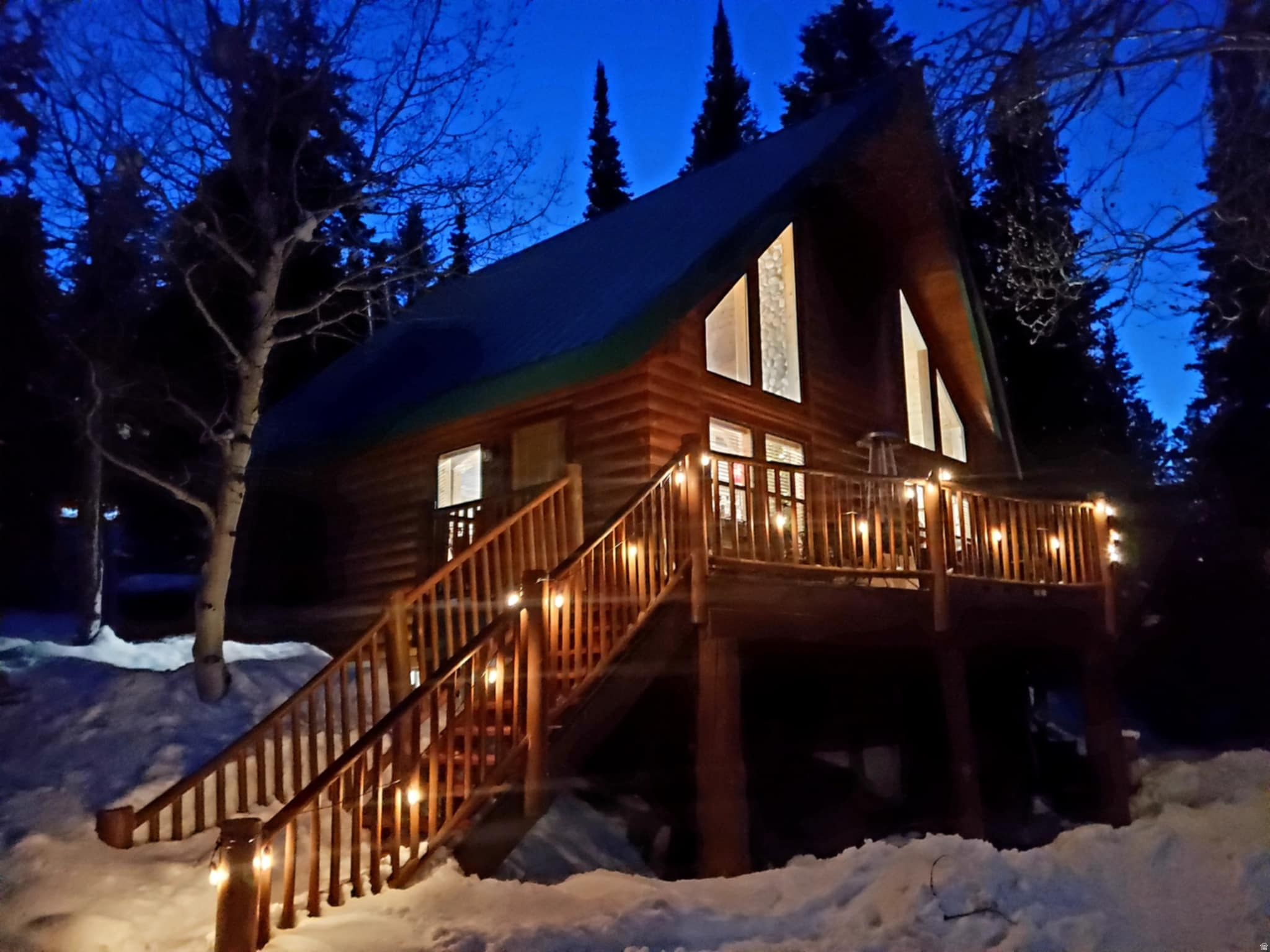 Charming Huntsville Cabin nestled on Monte Cristo in the Sunridge Highlands. You will not want to go back home to the bustling city after spending time away at your new Cabin. This cabin has one of the most amazing lots on the Mtn. There are only a select few lots on Sunridge that are nestled in the Pines with aspen groves all around. 2.4 acres lot with a secluded and private 'meadow' (yes, meadow..... Pics do not do this justice) for your entertaining and stargazing enjoyment. Firepit, Horse shoes, axe throwing and tetherball are already set up in the middle of the wooded lot awaiting your arrival. Back deck has a secluded outdoor tub with endless hot water for a private late night soak with bubbles and stars. Cabin has 3 bedrooms: The 'deer' room, the 'moose' room and the 'wolf' room. Also a huge loft that we call the 'bear' room. There is a bathroom on every level so your family and guests do not have to wander around at night when nature calls. Also, Laundry in the basement for those extended stays. Solar system with battery backup will give you endless off grid power (with generator backup) and the 1000 gal propane tank will keep you warm in the winter. Brand new metal roof installed in 2024. Cabin has year round water provided by Sunridge. This is an amazing piece of property that will provide you and your family with lifelong memories. Winter access is by snow machine only.  Owner/Agent.