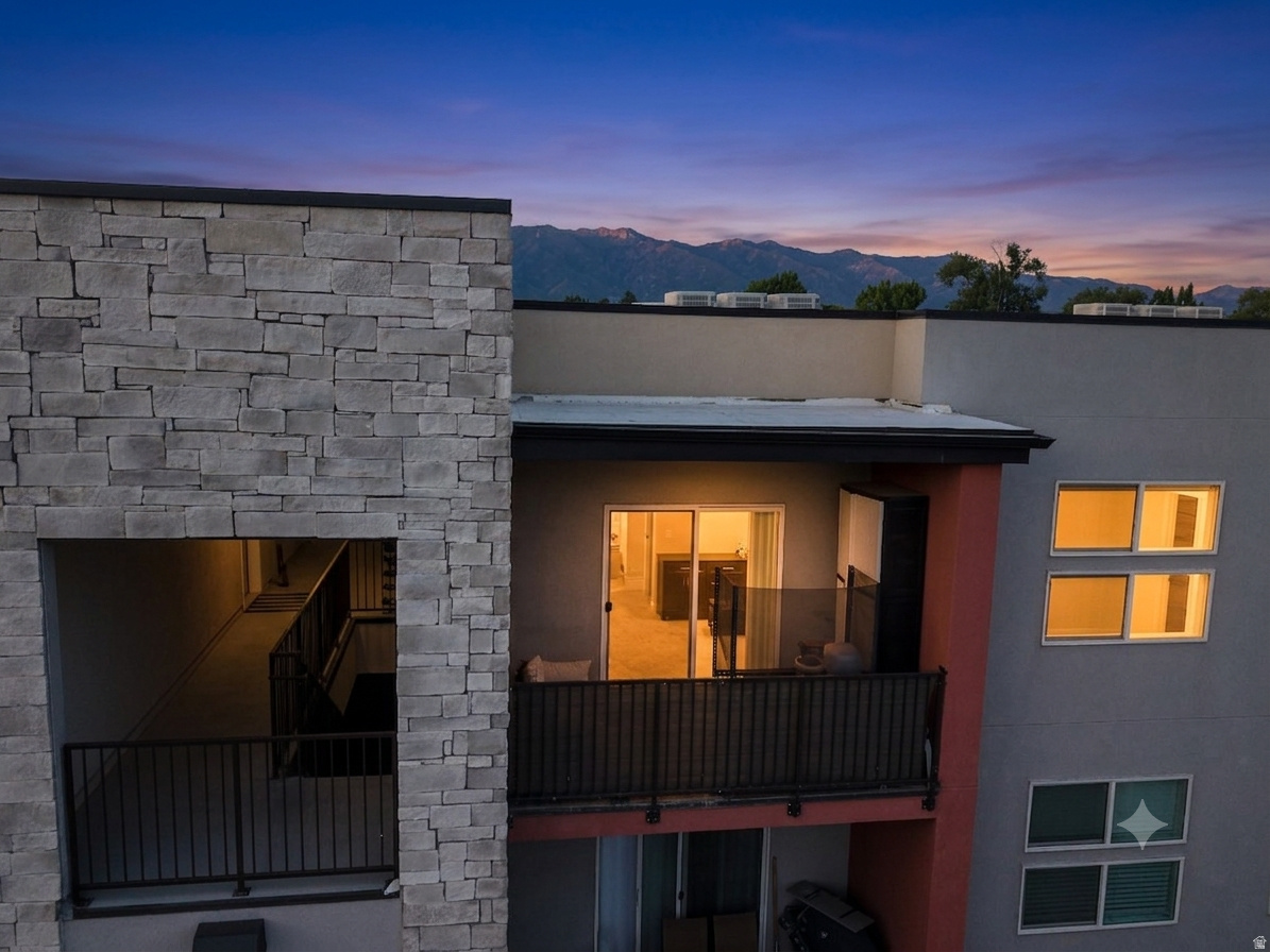 Experience elevated, maintenance-free living in this immaculate top-floor 1-bedroom, 1-bathroom condo positioned in Clearfield's premier transit-oriented corridor. Bathed in abundant natural light, this home pairs an open-concept architectural design with premium contemporary finishes. Modern Interior & Core Assets- Elevated View Corridor: Enjoy completely unobstructed, sweeping mountain and valley views from your private, covered balcony. Premium Kitchen Suite: Equipped with a culinary-focused layout featuring sleek modern countertops, a spacious dedicated food pantry, and full stainless steel appliances. High-Durability Flooring: Outfitted with premium waterproof laminate flooring throughout the high-traffic zones, blending aesthetic elegance with effortless upkeep. In-Unit Utility: Features a dedicated laundry space (in-unit washer/dryer hookups) and thoughtful storage closets to maximize the home's footprint.   Resort-Style HOA Amenities- Reclaim your downtime with an extensive community package covered by the association: Relaxation & Social Hubs: Full resident access to the community clubhouse, permanent outdoor barbecue/picnic stations, and a hot tub. Pet-Friendly Infrastructure: Features a dedicated neighborhood dog park right on-site.  Turnkey Maintenance: Monthly assessments completely cover exterior grounds upkeep, professional property management, snow removal, trash, and water infrastructure.   Exceptional Location & Commuter Data- This property leverages its position inside the Clearfield Station development to offer an unmatched "Mobility Score": The Front-Runner Edge: Situated within immediate walking distance of the Clearfield UTA Front-Runner Station, providing a seamless, vehicle-free commute along the entire Wasatch Front from Ogden down to Salt Lake City and Provo. Military & Defense Hub Proximity: Located just minutes from the gates of Hill Air Force Base (HAFB), making this an ideal residence for defense contractors, civil servants, and military personnel. Industrial & Corporate Hubs: Positioned directly adjacent to the Freeport Center, a major regional manufacturing, warehousing, and commercial employment hub. Retail & Corridors: Less than 5 minutes to I-15 access, local dining hotspots, and regional shopping centers like the Layton Hills Mall corridor just to the south.